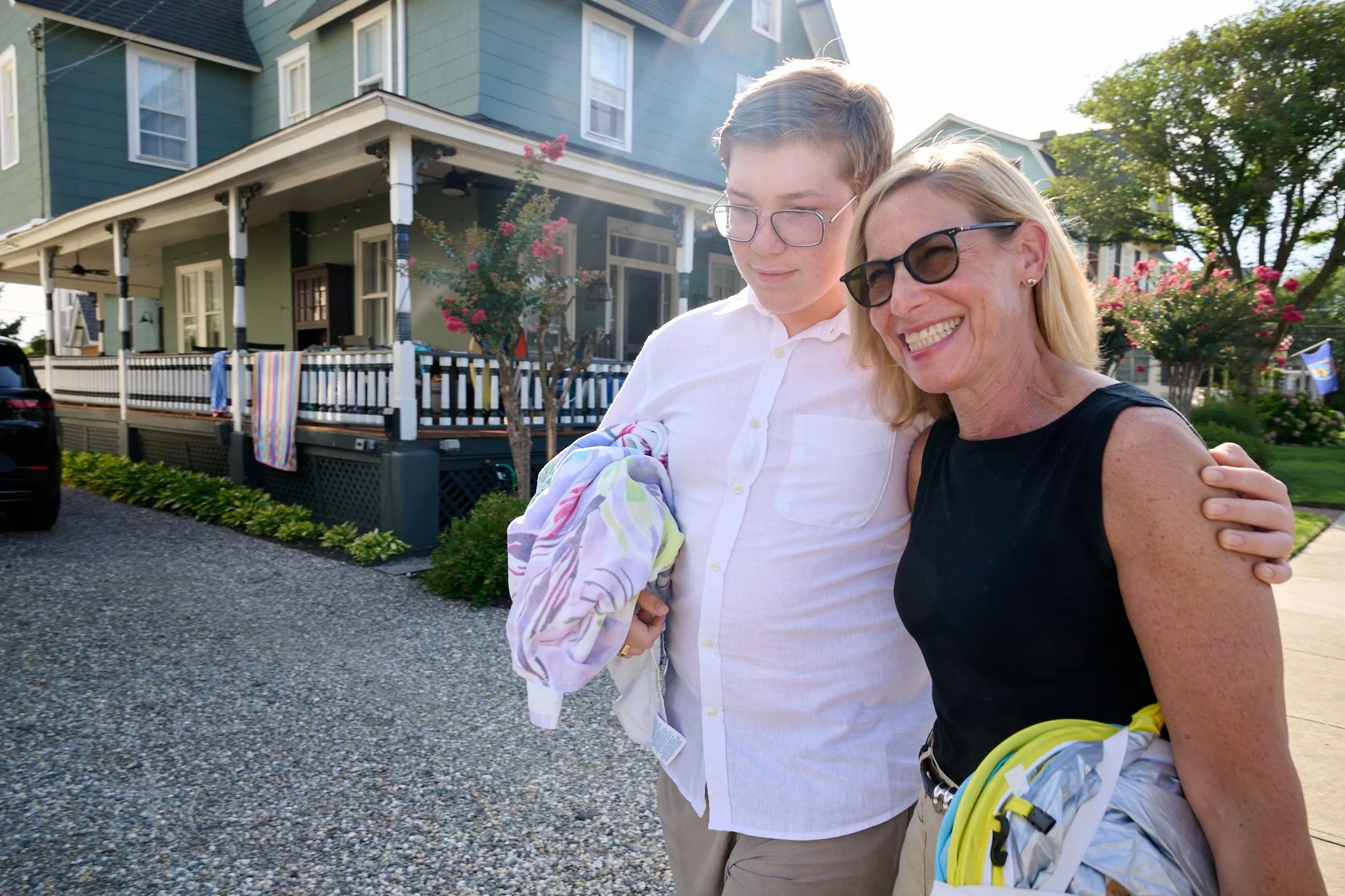 Mother and son head to beach in Beach Haven on the Jersey Shore by family photographer Pamela Einarsen.