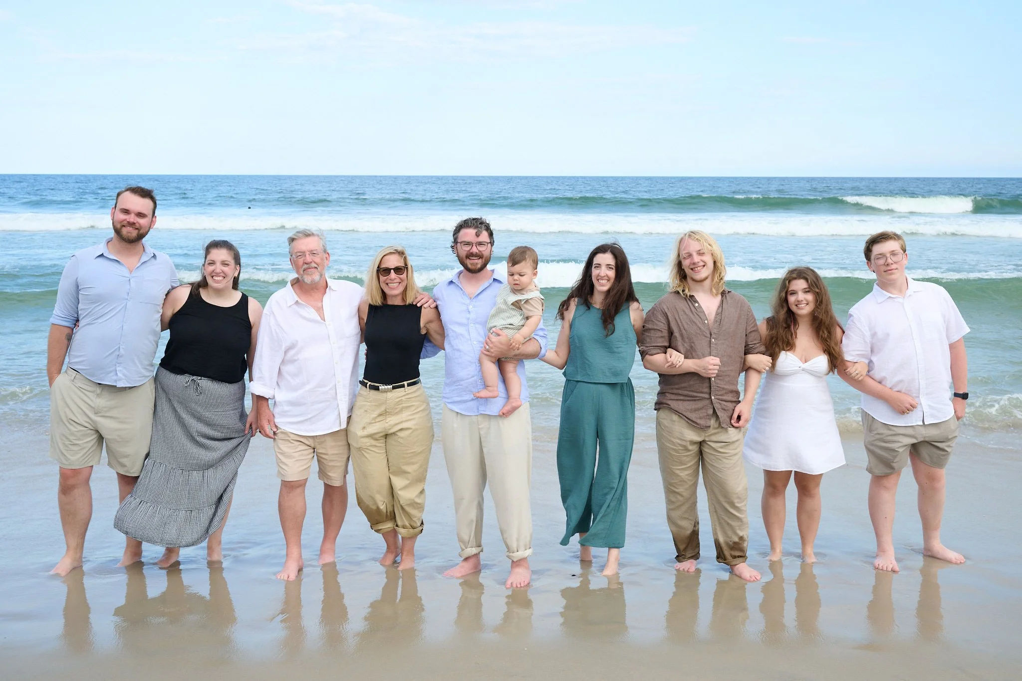 An extended family poses on a Jersey Shore beach with family photographer Pamela Einarsen.  