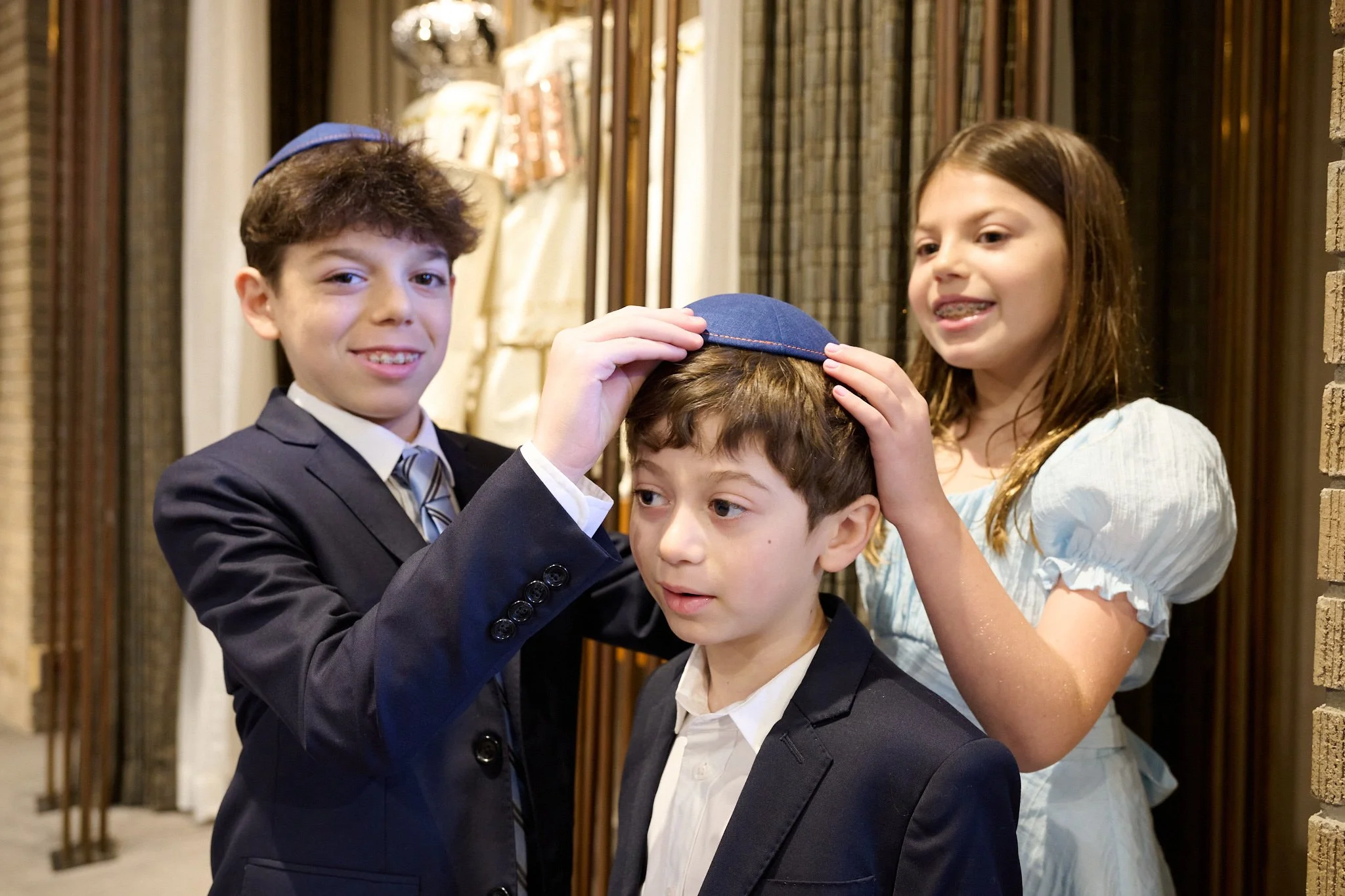 Family poses at Temple Israel in Westport, CT before a Bar Mitzvah with event photographer Pamela Einarsen. 