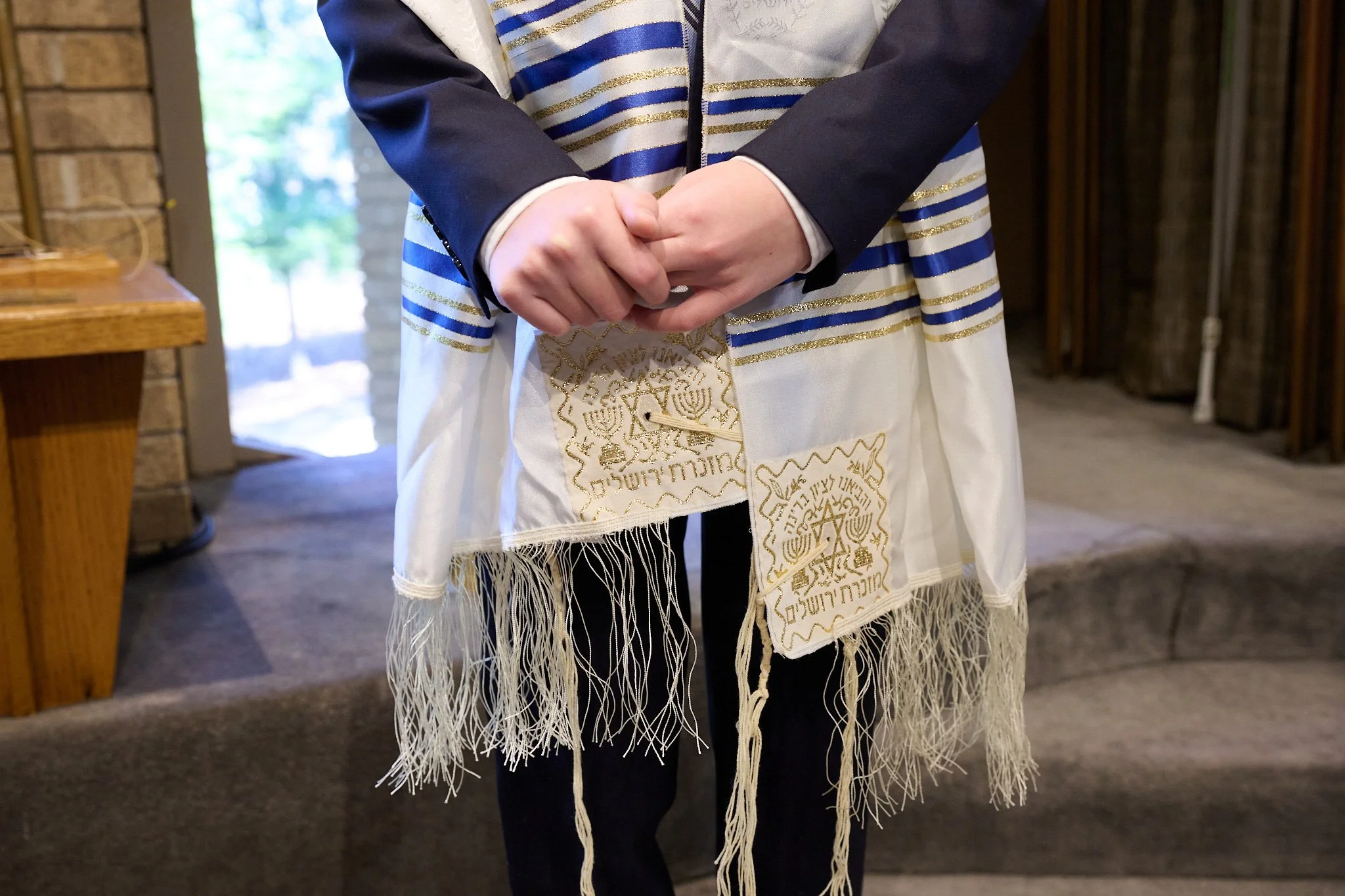 Bar Mitzvah boy’s hands at Temple Israel in Westport, CT by event photographer Pamela Einarsen.