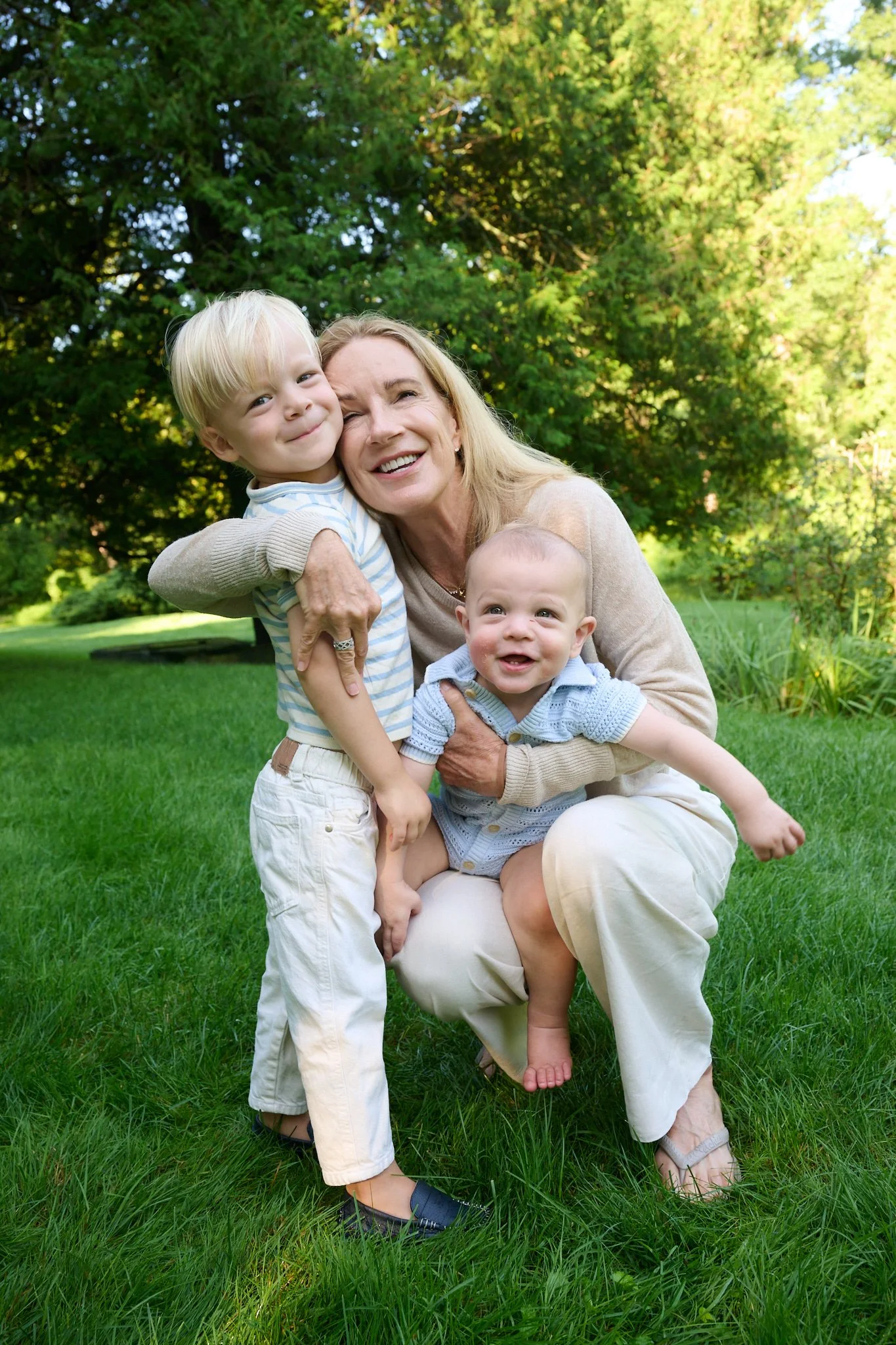 Grandmother hugs her grandsons at Westport CT home by extended family photographer Pamela Einarsen. 
