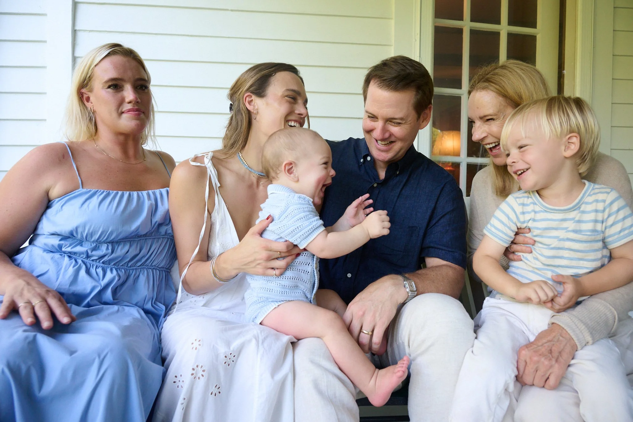 Family laughs together at Westport CT home for extended family photographer Pamela Einarsen. 