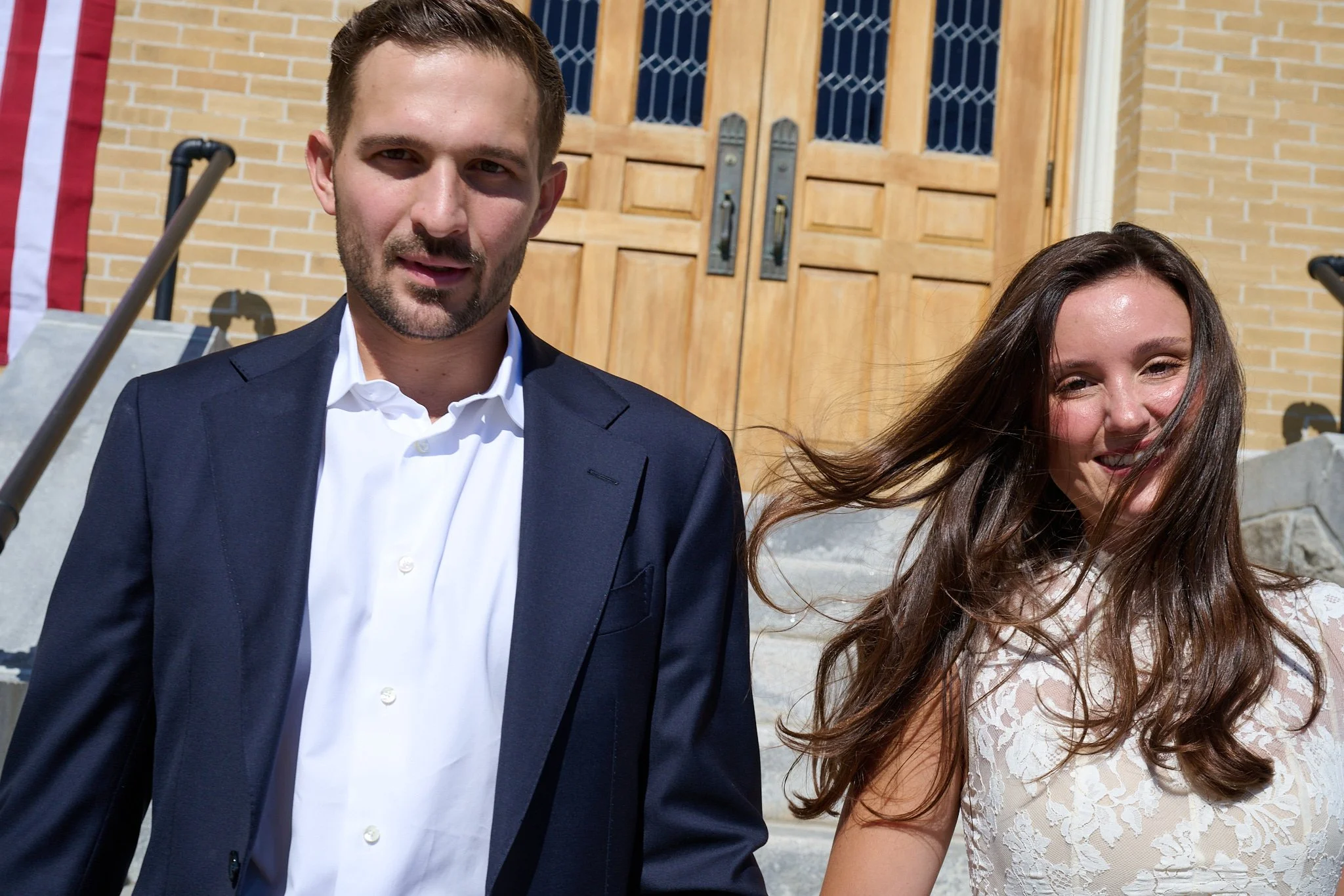 Bride and groom outside of Church of the Assumption in Westport, CT after getting married by wedding photographer Pamela Einarsen. 