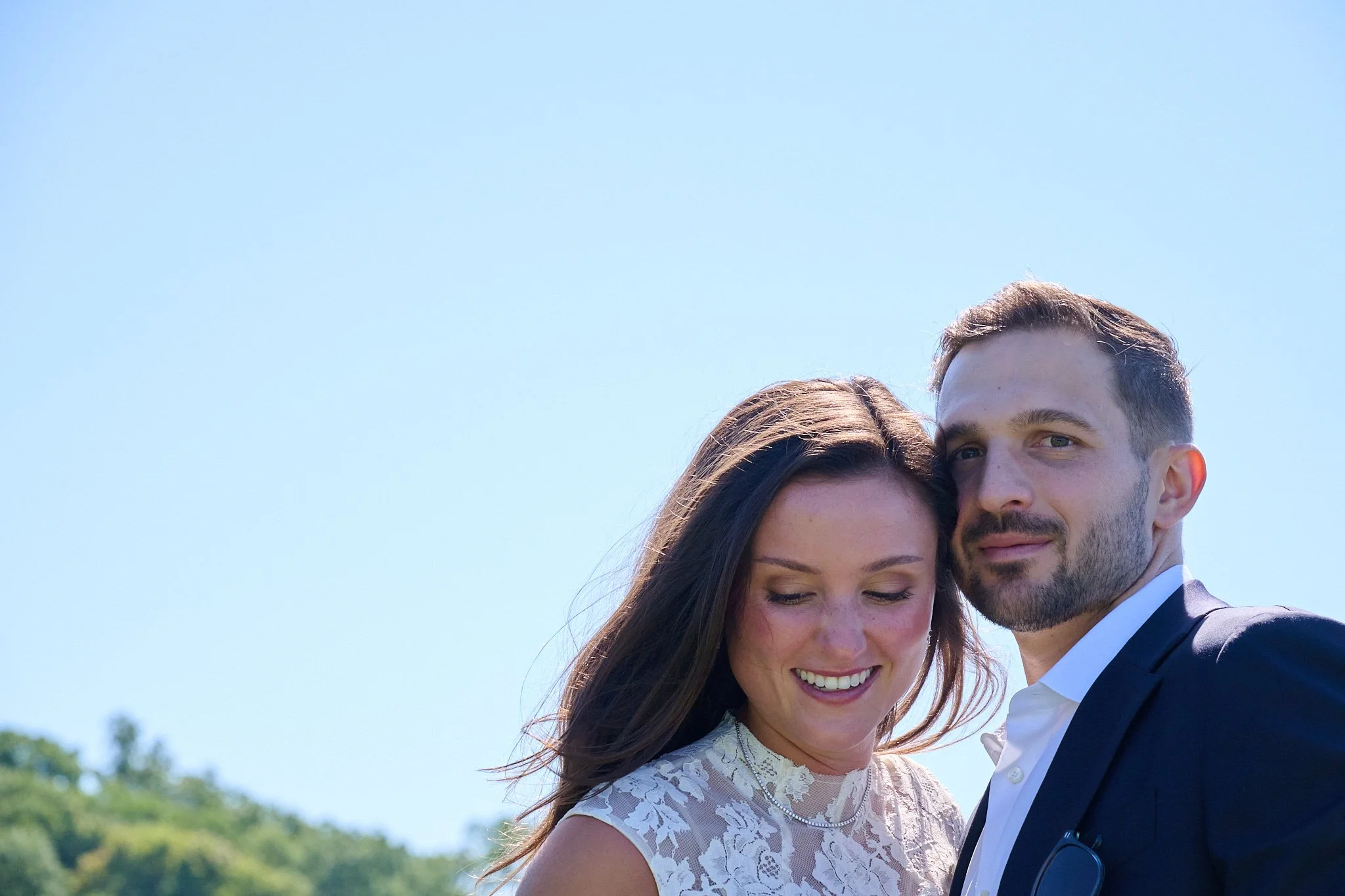 Portrait of bride and groom on their lawn in Westport, CT by wedding photographer Pamela Einarsen. 