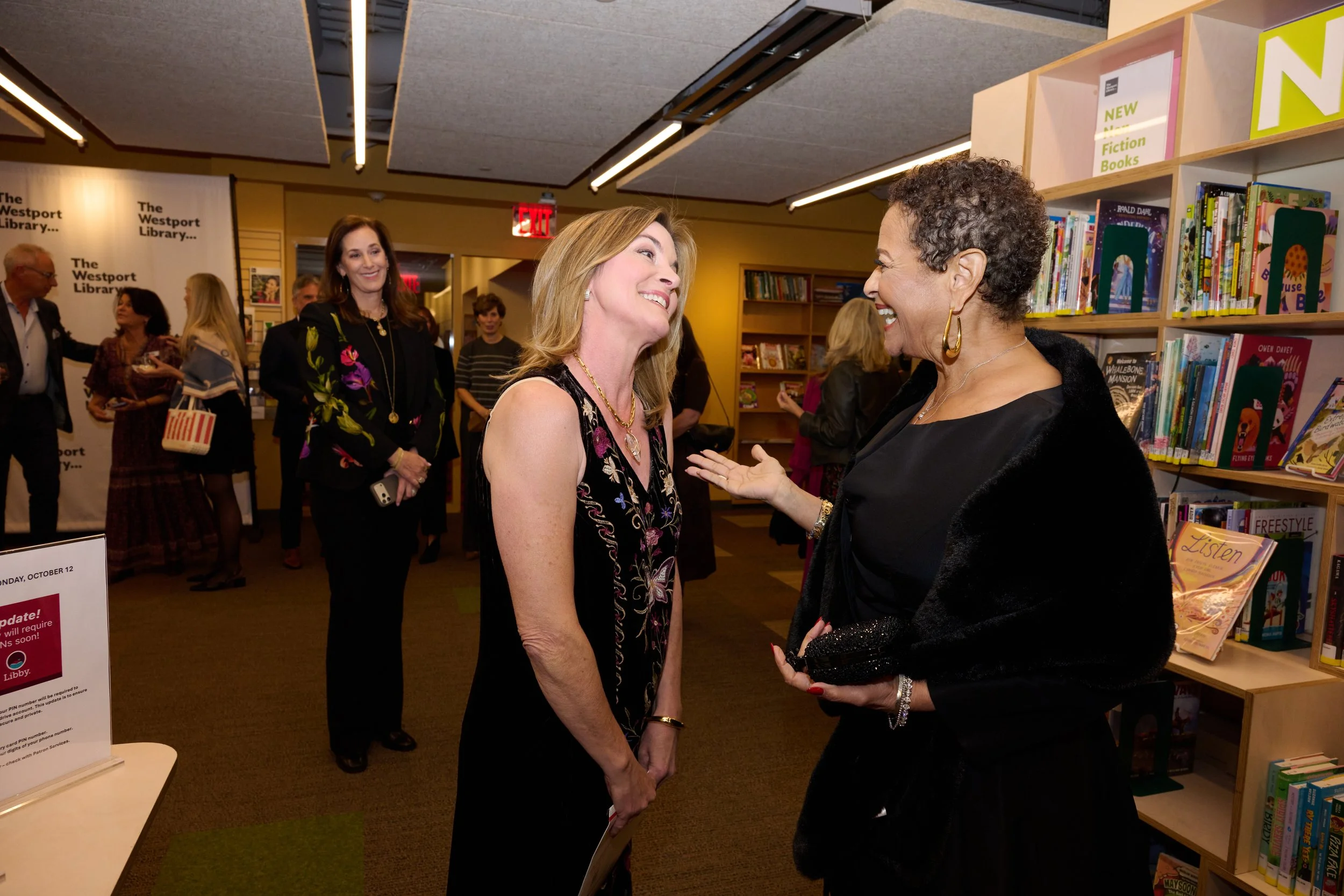 Actress Cynthia Gibb greets Booked for the Evening honoree Debbie Allen in Westport CT with event photographer Pamela Einarsen. 