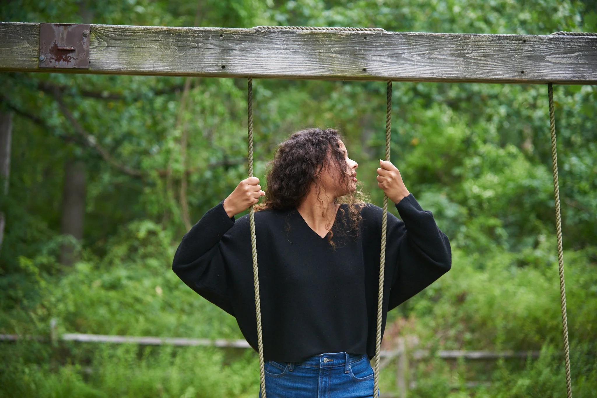 Young woman plays on a rope swing in Norwalk — one of the towns Pamela Einarsen photographs across Fairfield County