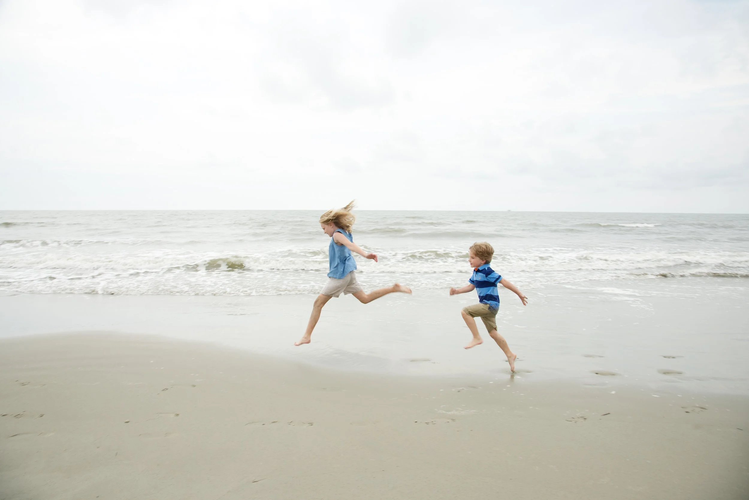 Kids play on Kiawah Island beach for candid photographer