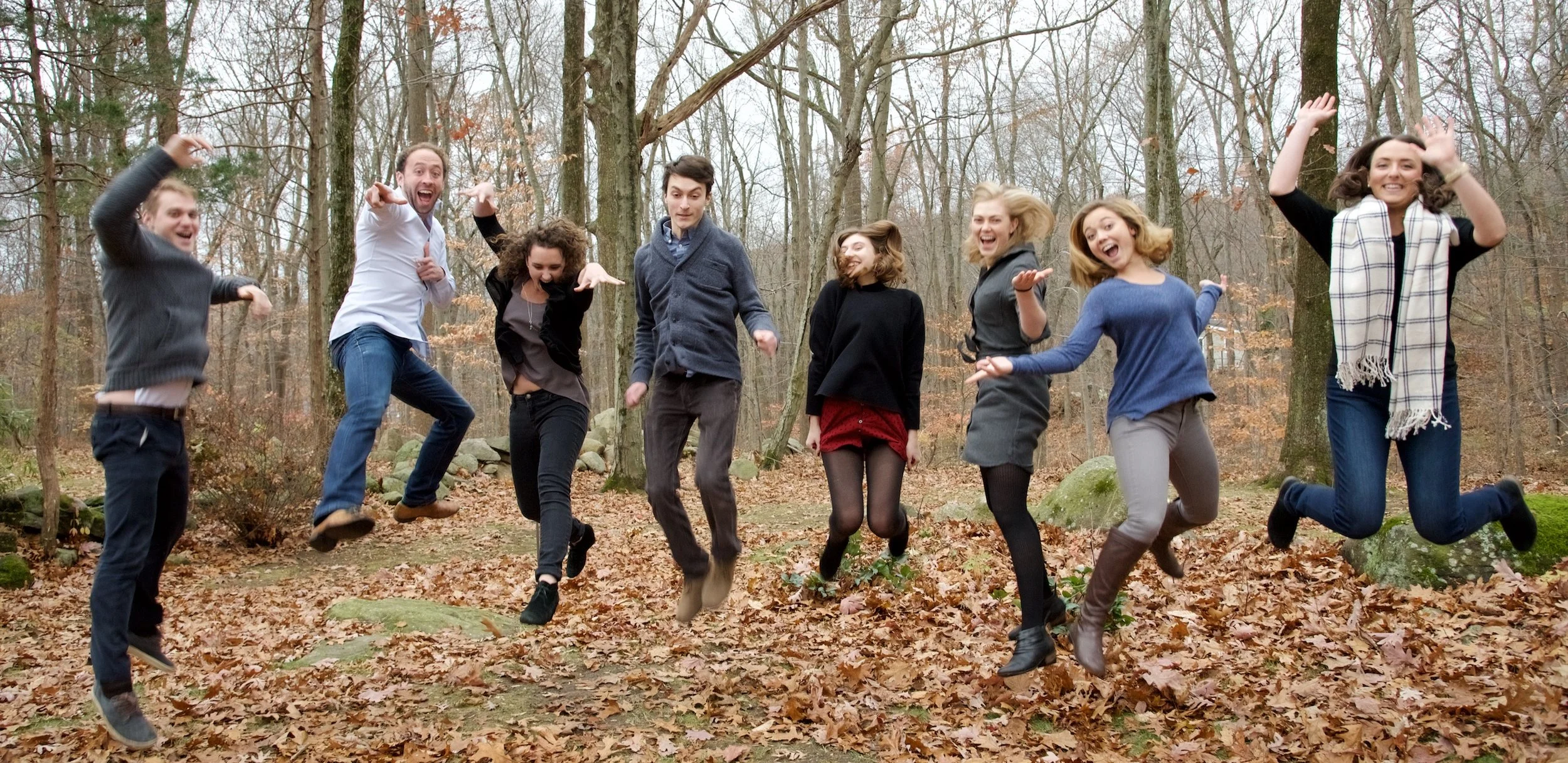 Family walks together through the woods in Wilton — one of the towns Pamela Einarsen photographs across Fairfield County