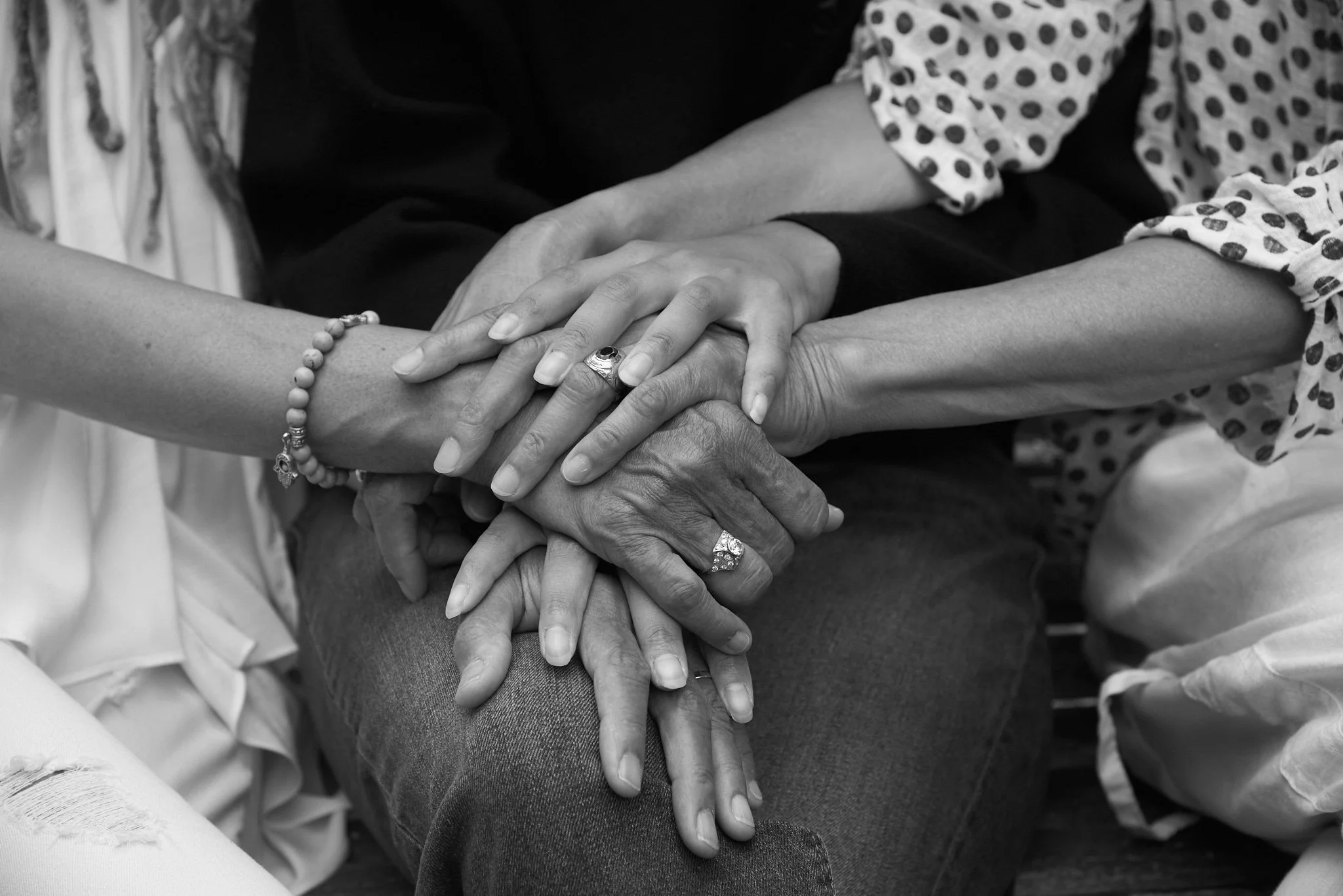 Family photo session in Norwalk, Connecticut, captures B&W of mother's hands with daughter