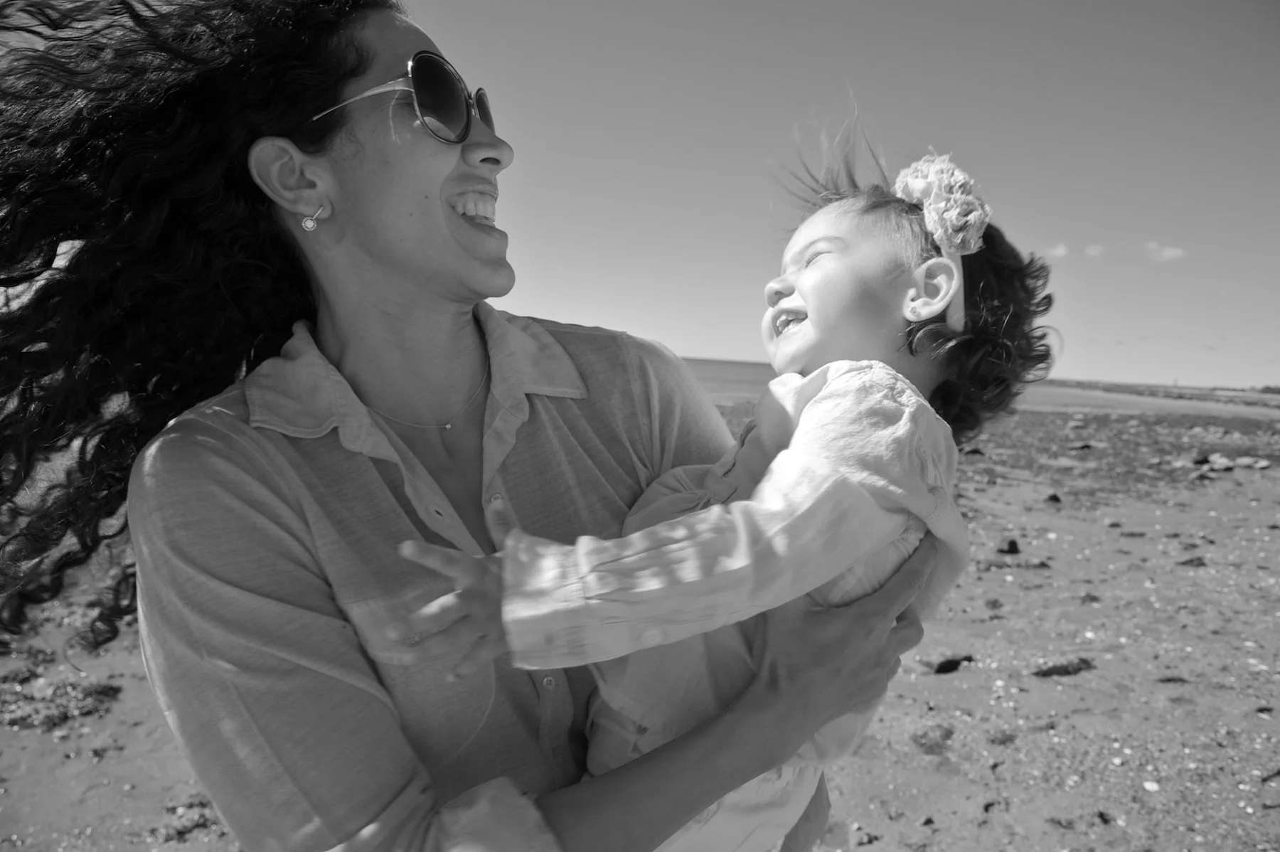 Fairfield. CT mom and daughter laugh on the beach