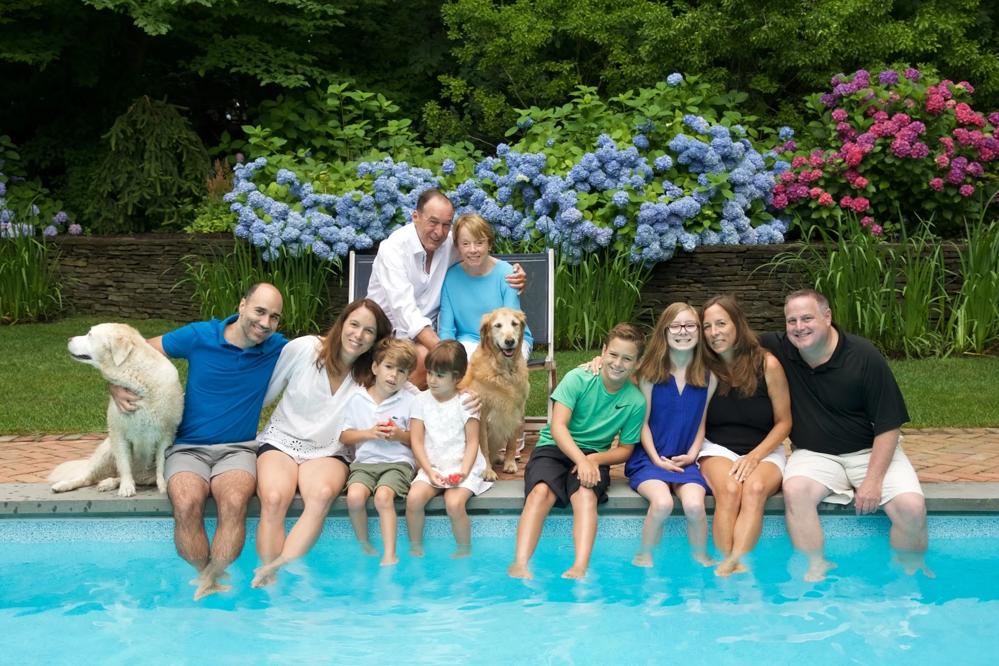 Extended family by pool in Hampton home by lifestyle photographer