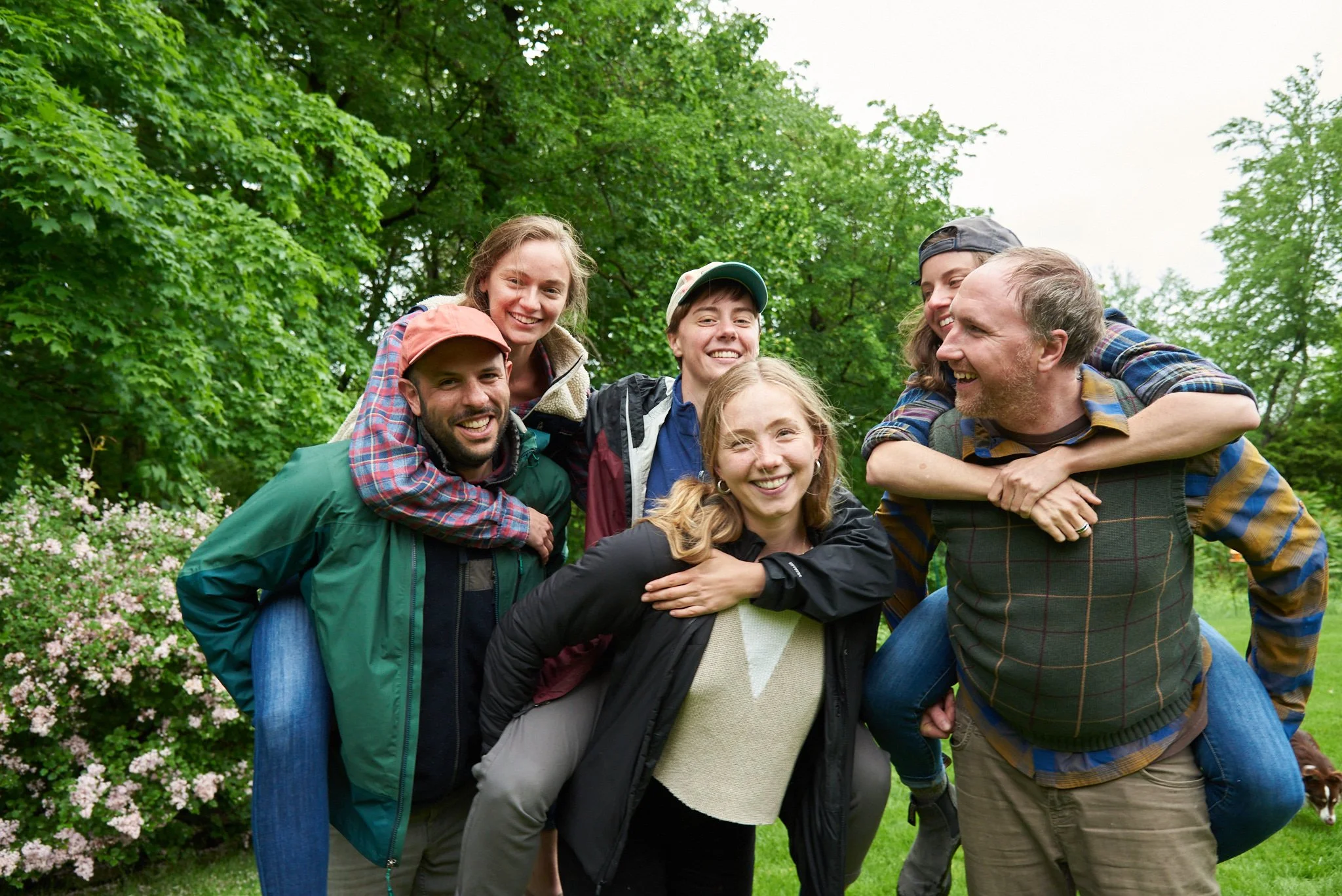 Family laughs in Weston, Connecticut backyard as photographer captures fun lifestyle photos