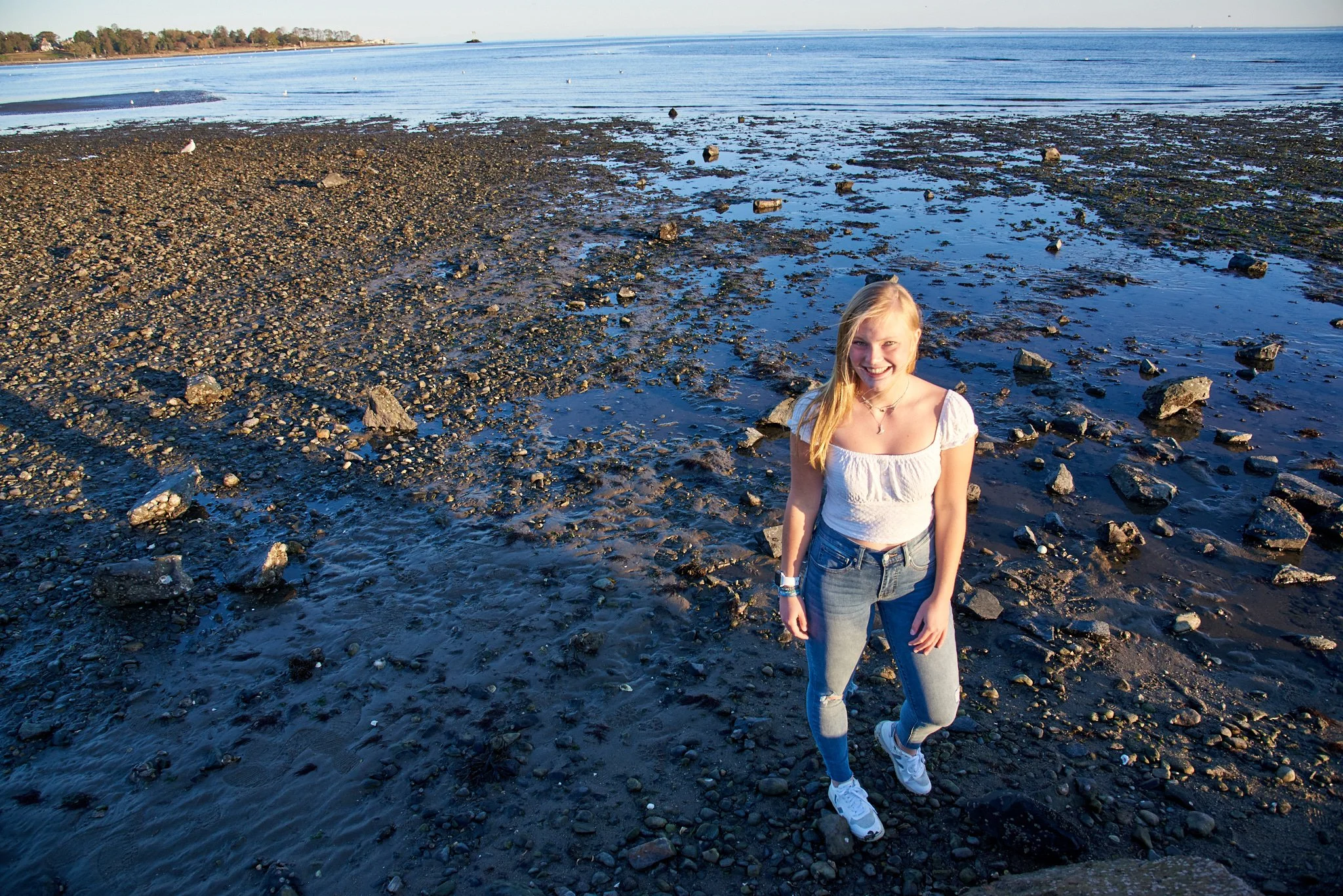 Girl smiles at Southport beach photographer