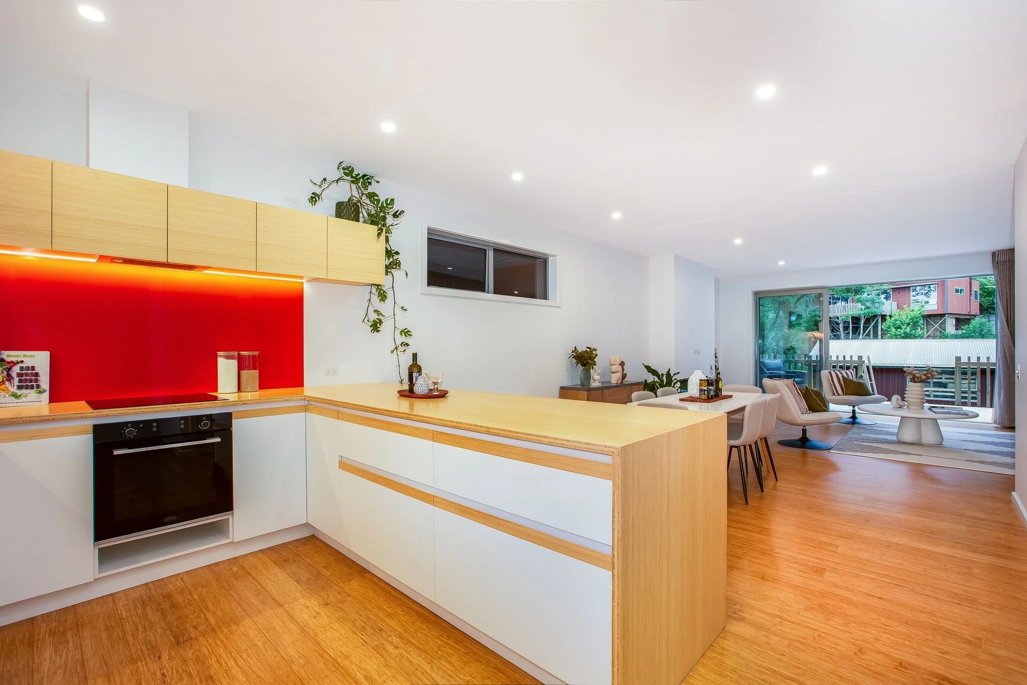 As you enter the main part of the house you can see from the Kitchen through the ground floor to the deck facing the village green.