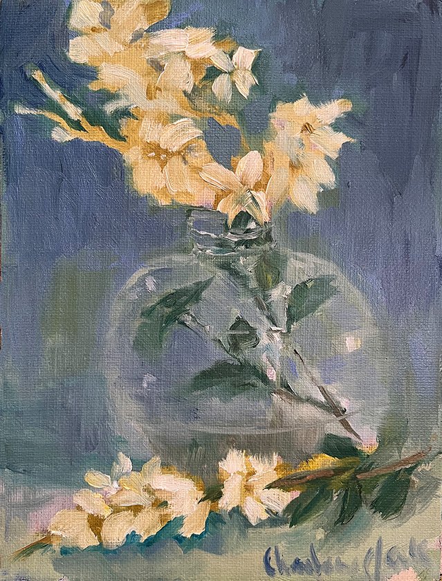 White Flowers in Juice Bottle