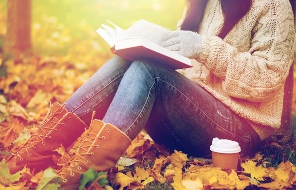 woman_in_park_with_book.jpg