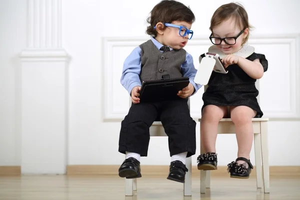 little_kids_looking_at_cell_phone.jpg