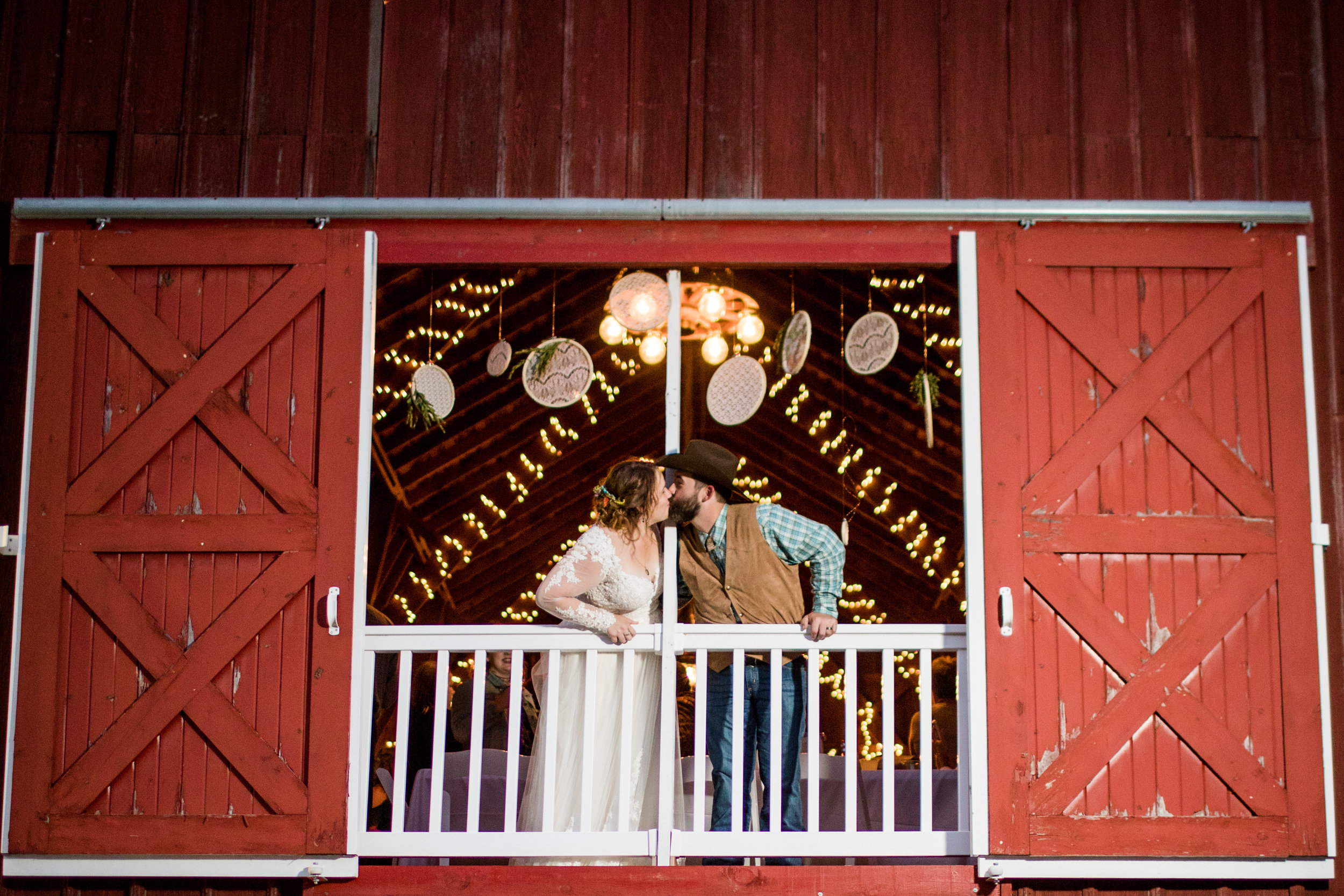 Bride and Groom in Barn Window