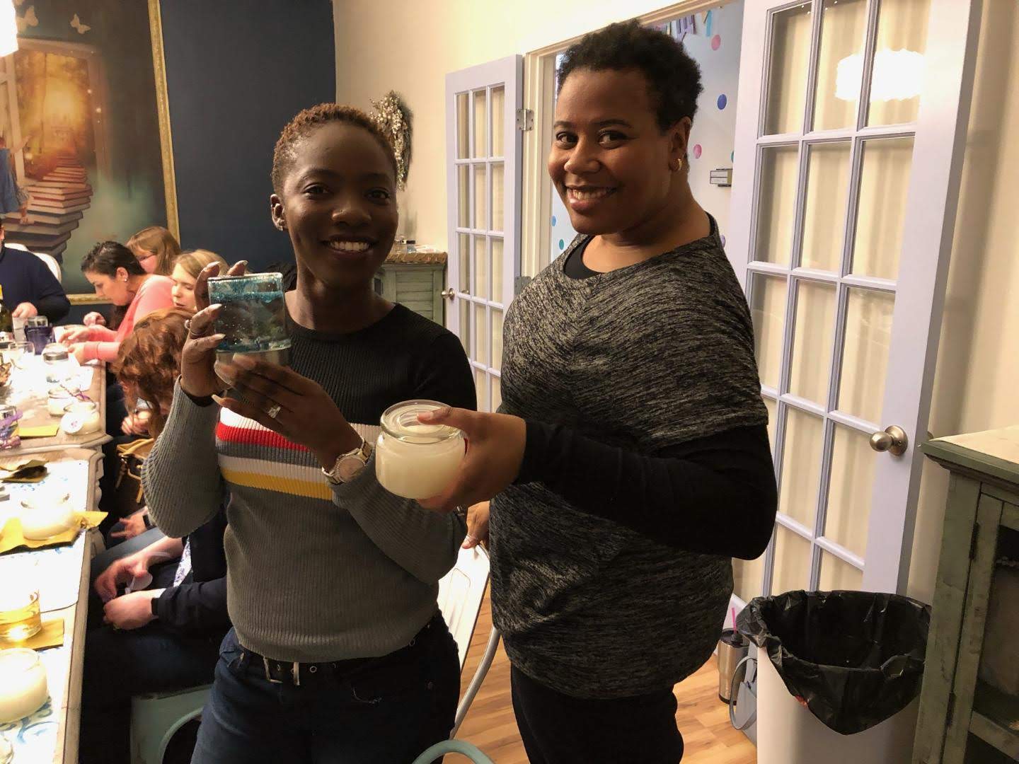 Showing off their handmade snow globe and sugar scrub!