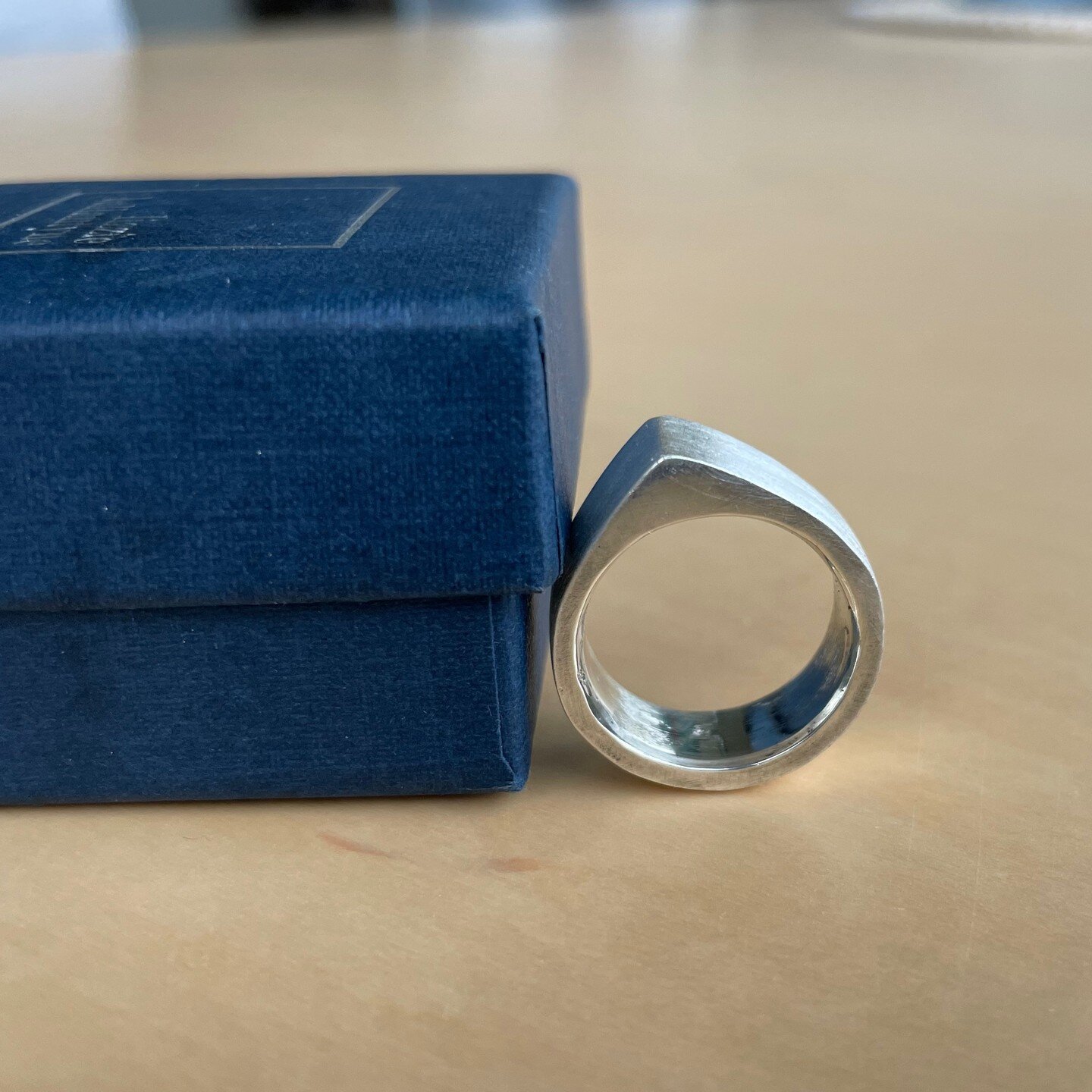 I'd had a couple of failures while casting rings over the past few days, so I tried again this afternoon. 
Pic 1. Almost finished ring, needs more polishing in daylight.
Pic 2. I've just poured molten recycled silver into a cast I made using Delft cl