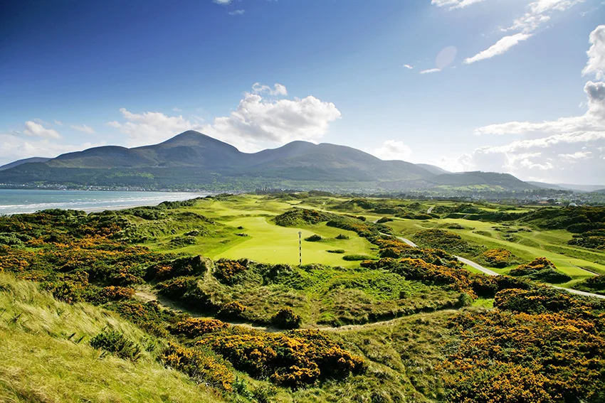 The marker post is often required on the majestic 3rd green at Royal County Down, while the par-4 3rd is to the right.