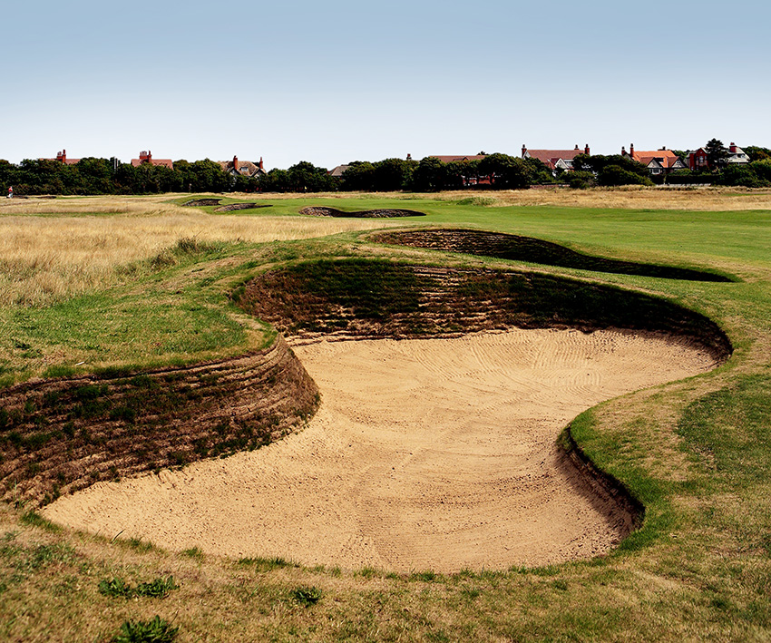 BEFORE: At the 2006 Open, the revetting extended to the entire height of the bunker face, creating an excessively harsh and stark look.