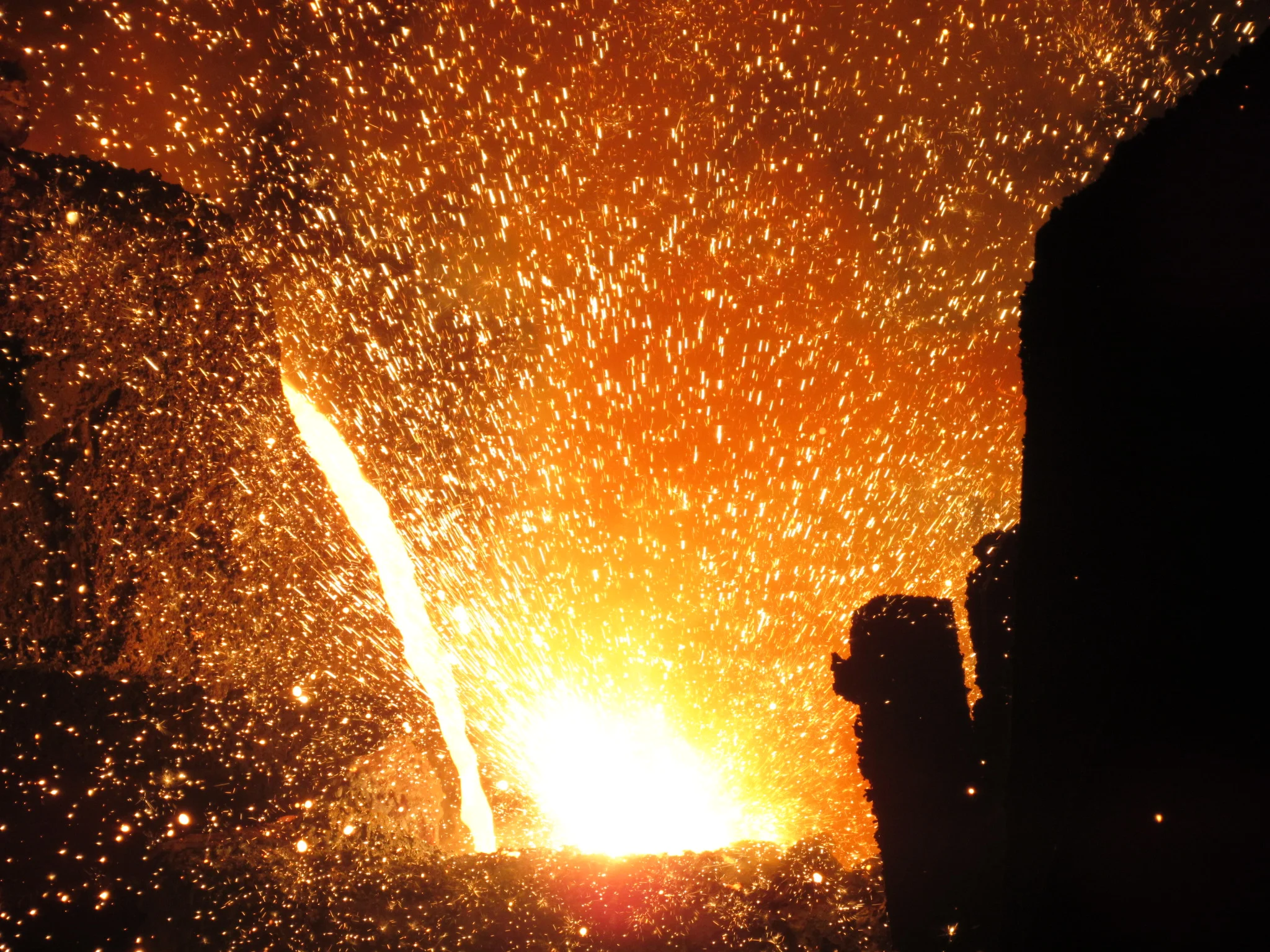 Iron being transferred from the 40 ton electric furnace to the transfer ladle.JPG