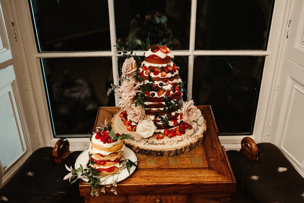 rustic strawberry wedding cake with sponge and cream for wedding at drumtochty castle planned by a Scottish destination wedding planner