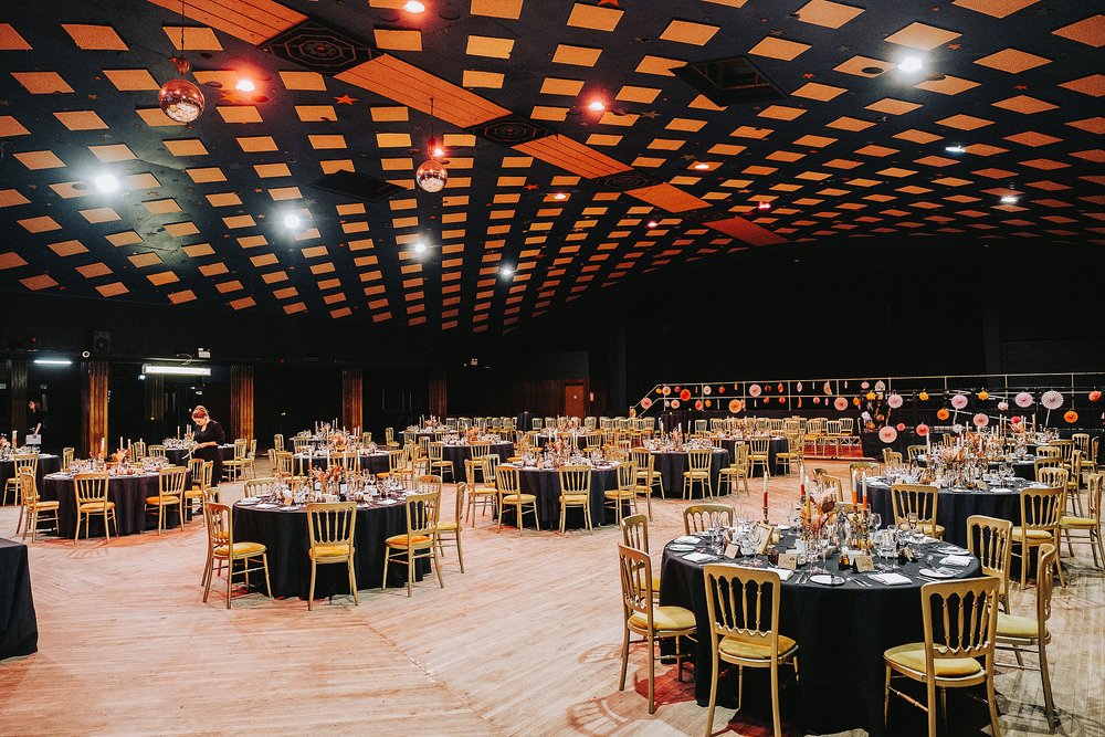 inside barrowlands which is a diy wedding venue scotland set up for a reception with round tables