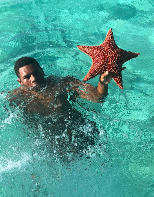 Our new friend, Junior (Theo’s son), jumped in the water from the boat and brought up this HUGE starfish. So cool!