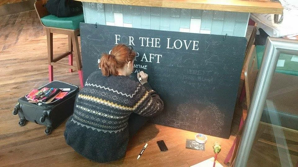 Chloe-Garrett-signwriting-for-the-first-time-in-Gherkin-bar-London-1.jpg