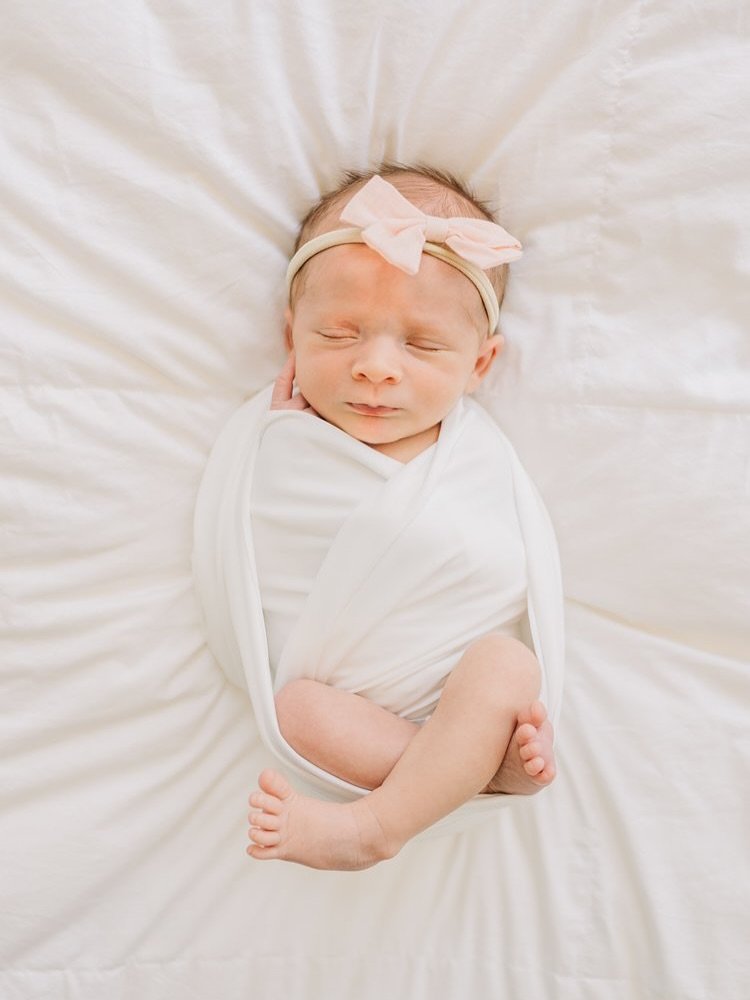 The sweetest little swaddled up baby girl. I love seeing the tiny toes out in newborn photos. We were able to capture so much variety during this newborn session. One thing I love about in home newborn sessions is that it allows for capturing so many