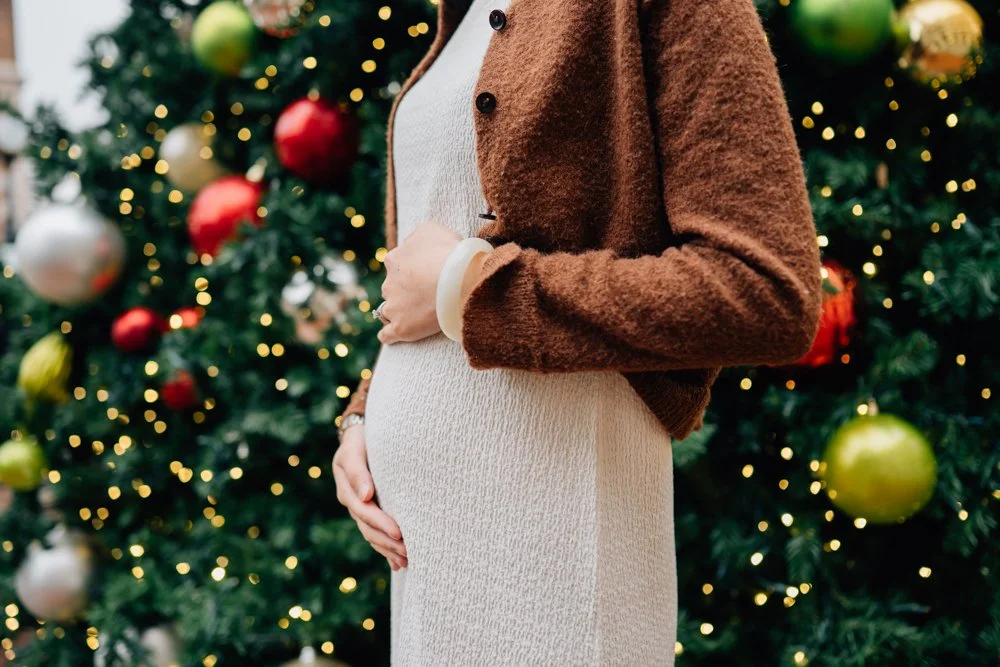  Best Maternity Photographer in Greenville. SC takes Christmas maternity photos in downtown Greenville, SC 