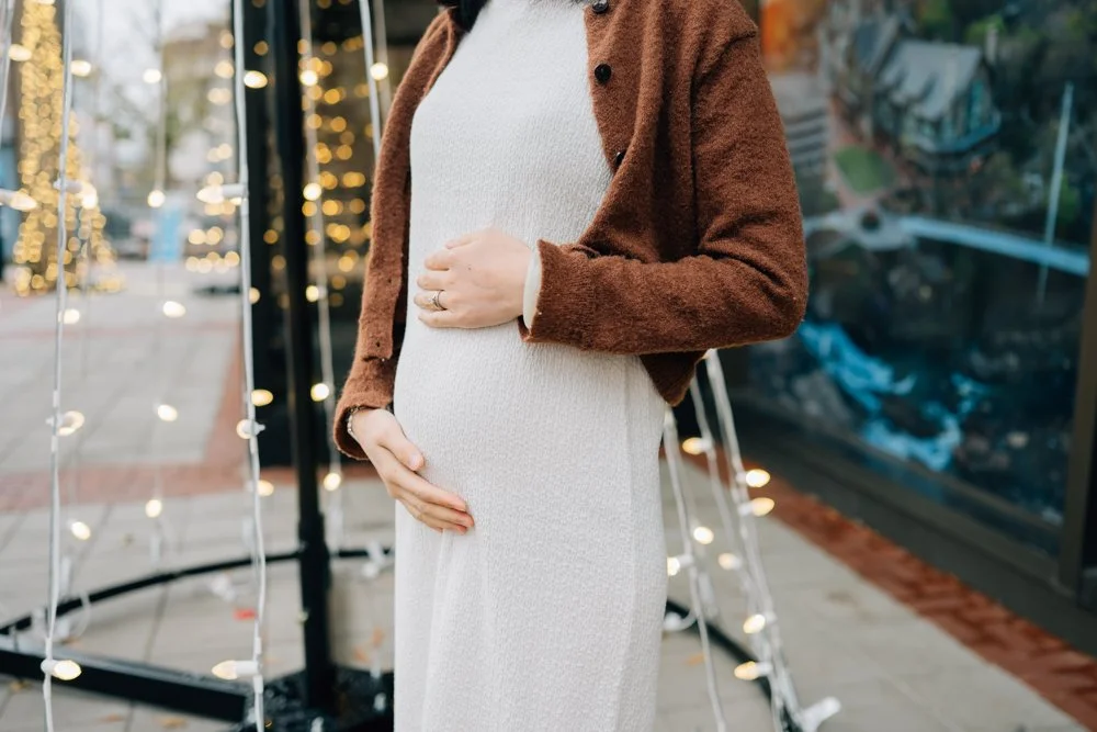  Best Maternity Photographer in Greenville. SC takes Christmas maternity photos in downtown Greenville, SC 