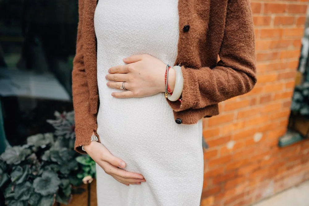  Best Maternity Photographer in Greenville. SC takes Christmas maternity photos in downtown Greenville, SC 