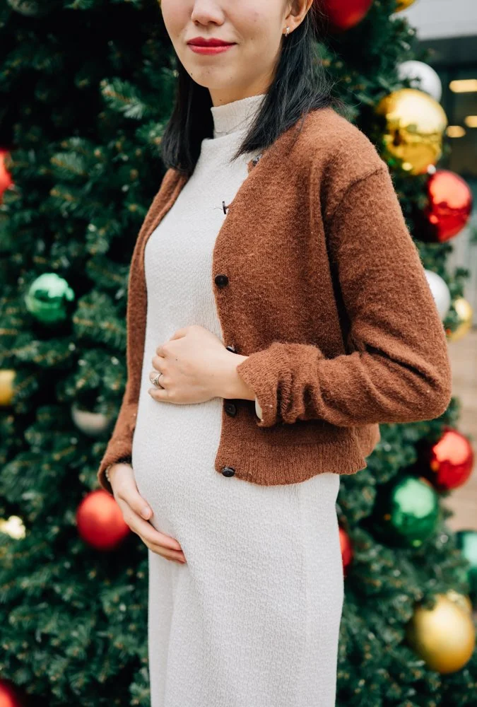  Best Maternity Photographer in Greenville. SC takes Christmas maternity photos in downtown Greenville, SC 