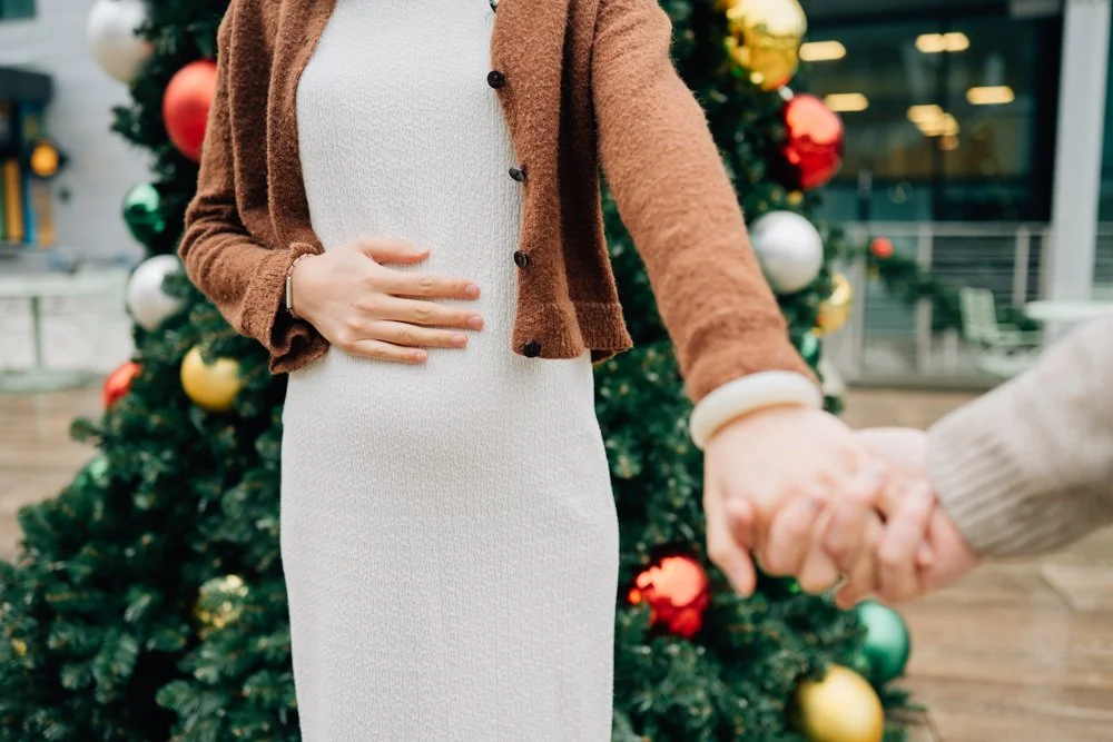  Best Maternity Photographer in Greenville. SC takes Christmas maternity photos in downtown Greenville, SC 