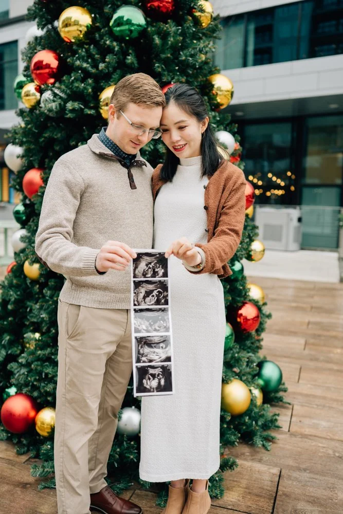 Best Maternity Photographer in Greenville. SC takes Christmas maternity photos in downtown Greenville, SC 