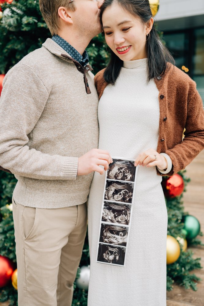  Best Maternity Photographer in Greenville. SC takes Christmas maternity photos in downtown Greenville, SC 