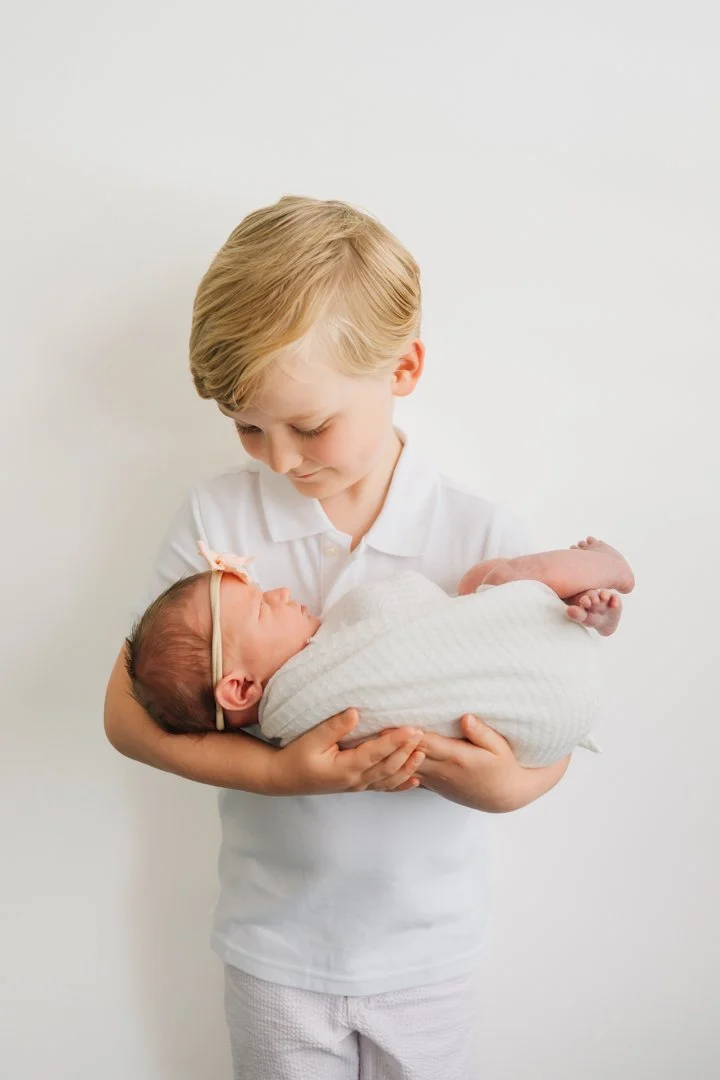  Newborn Photographers in Greenville, SC with a client closet and baby props 