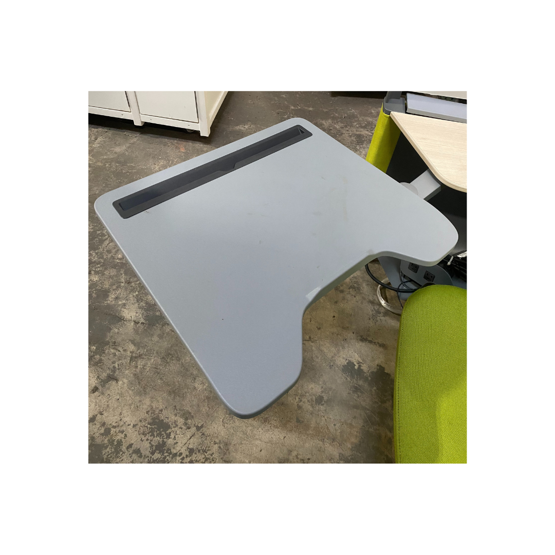 Gray tilt-adjustable tablet work surface on a Steelcase Brody workstation, ideal for focused work or study, pre-owned and available locally in Morrisville, NC