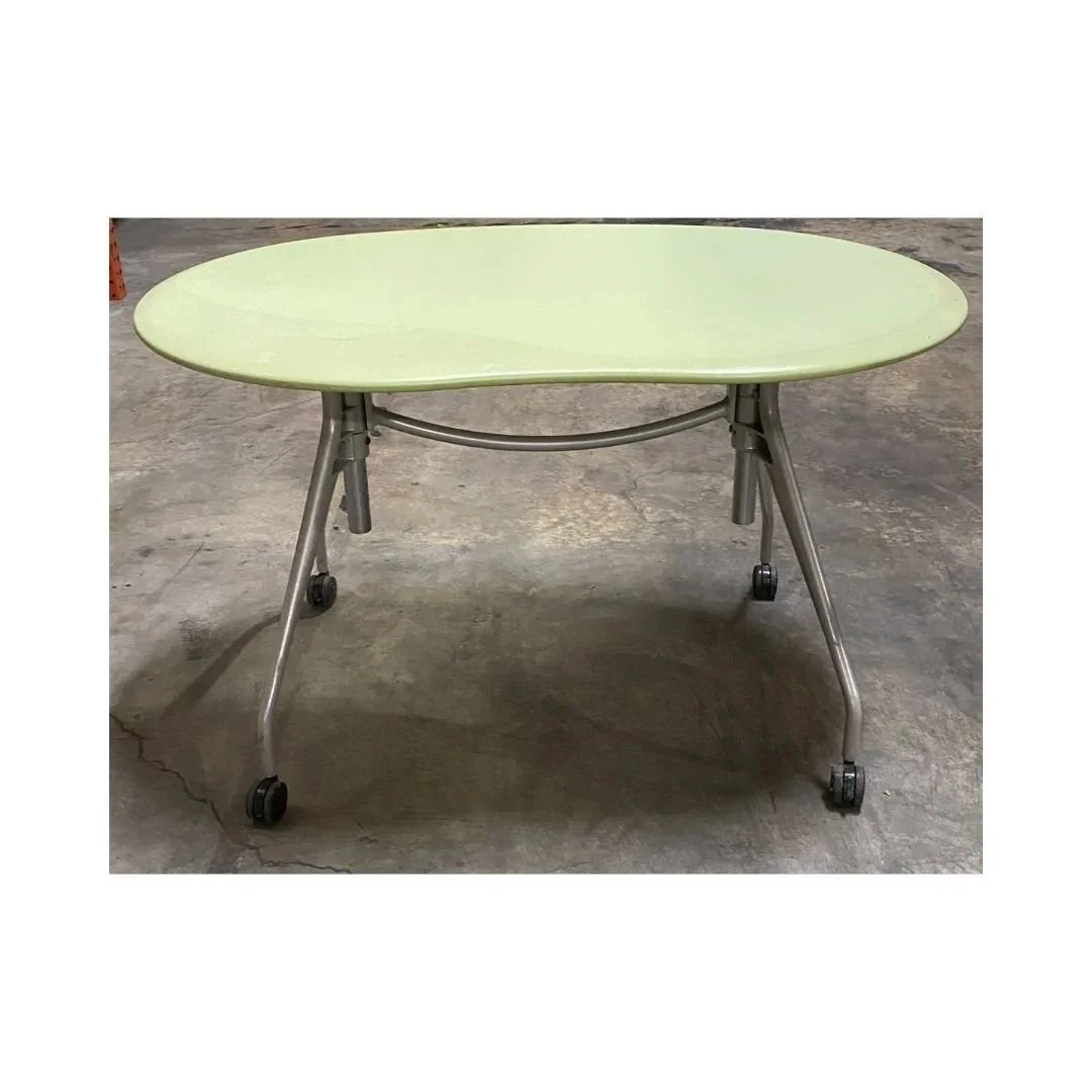 Green laminate curved table for classroom or meeting space