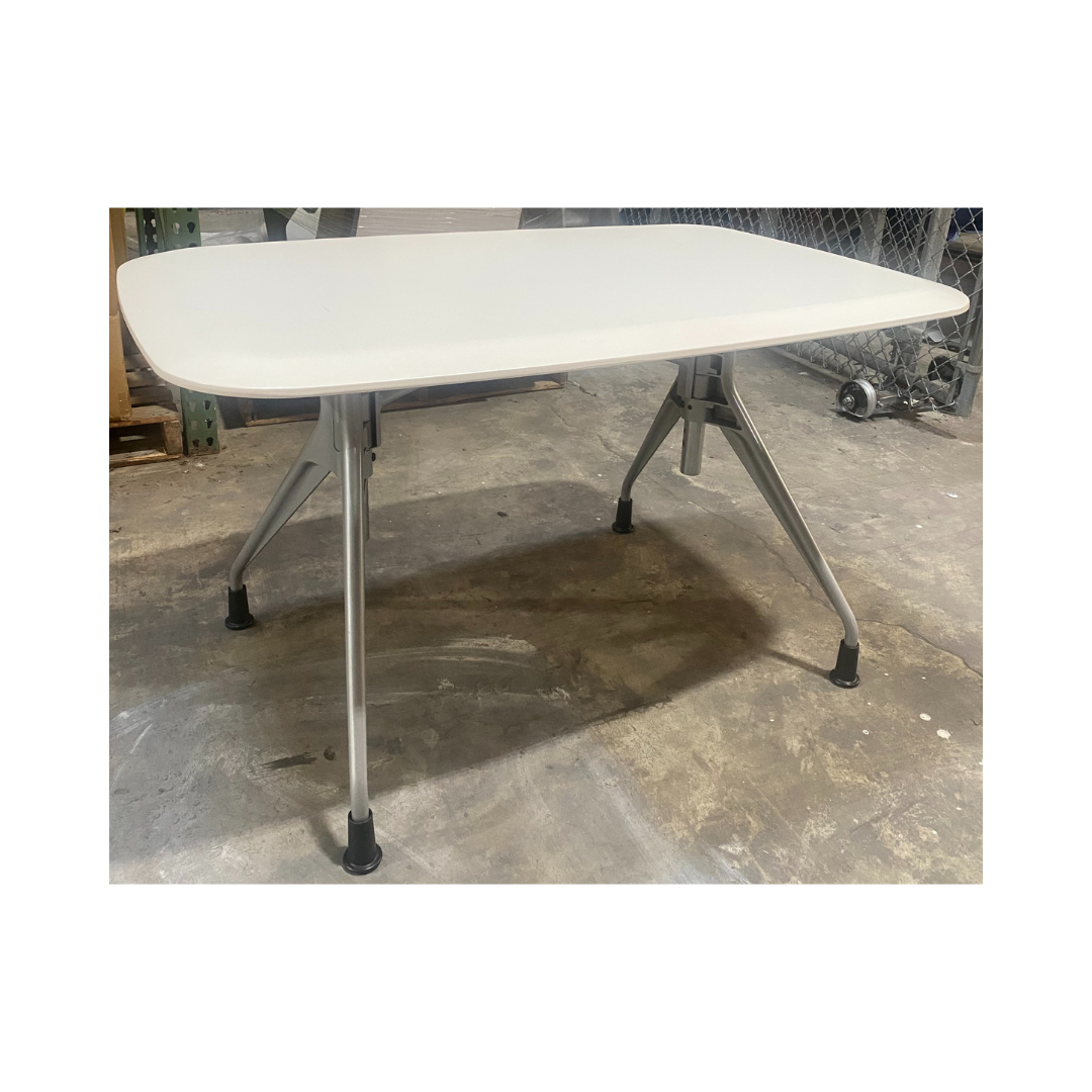 Herman Miller Avive table with gently curved tabletop edges and sturdy aluminum leg base