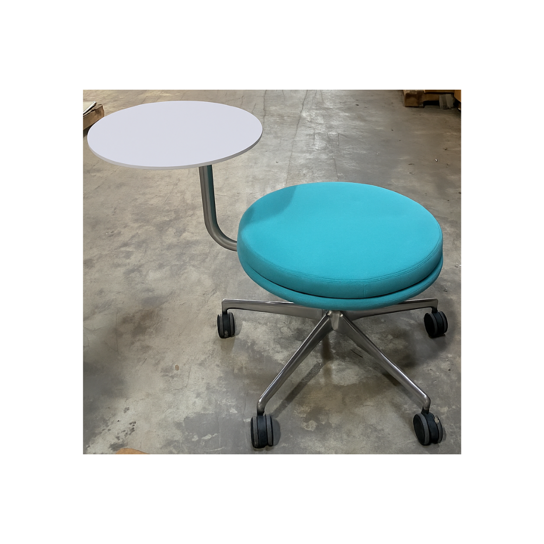 Juxta Stool by Keilhauer featuring a round turquoise upholstered seat on a polished aluminum base with five casters and an integrated white swivel side table, Available for purchase in Raleigh, NC