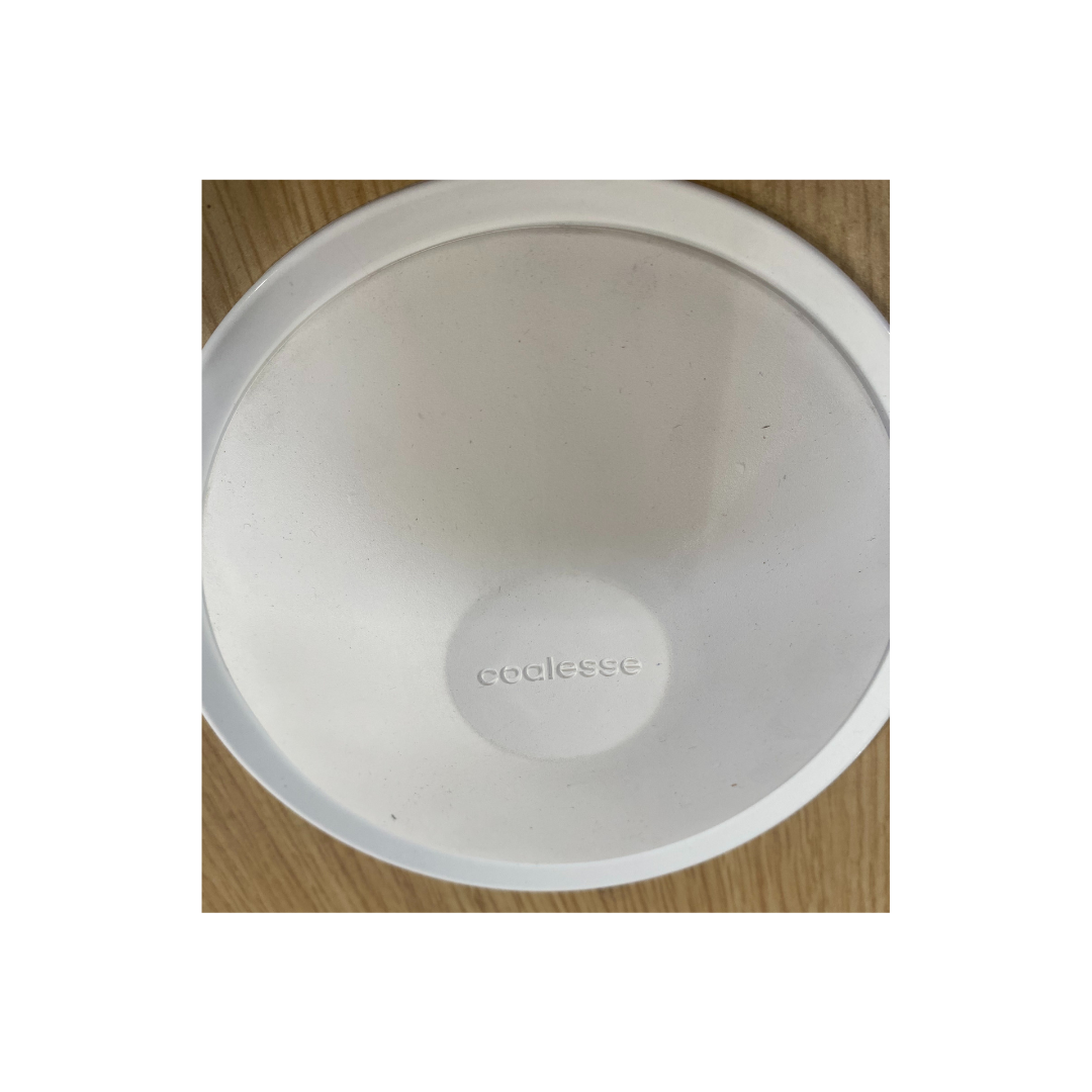 Contemporary Coalesse conference table shown in warehouse, featuring twin grommet ports and polished metal supports