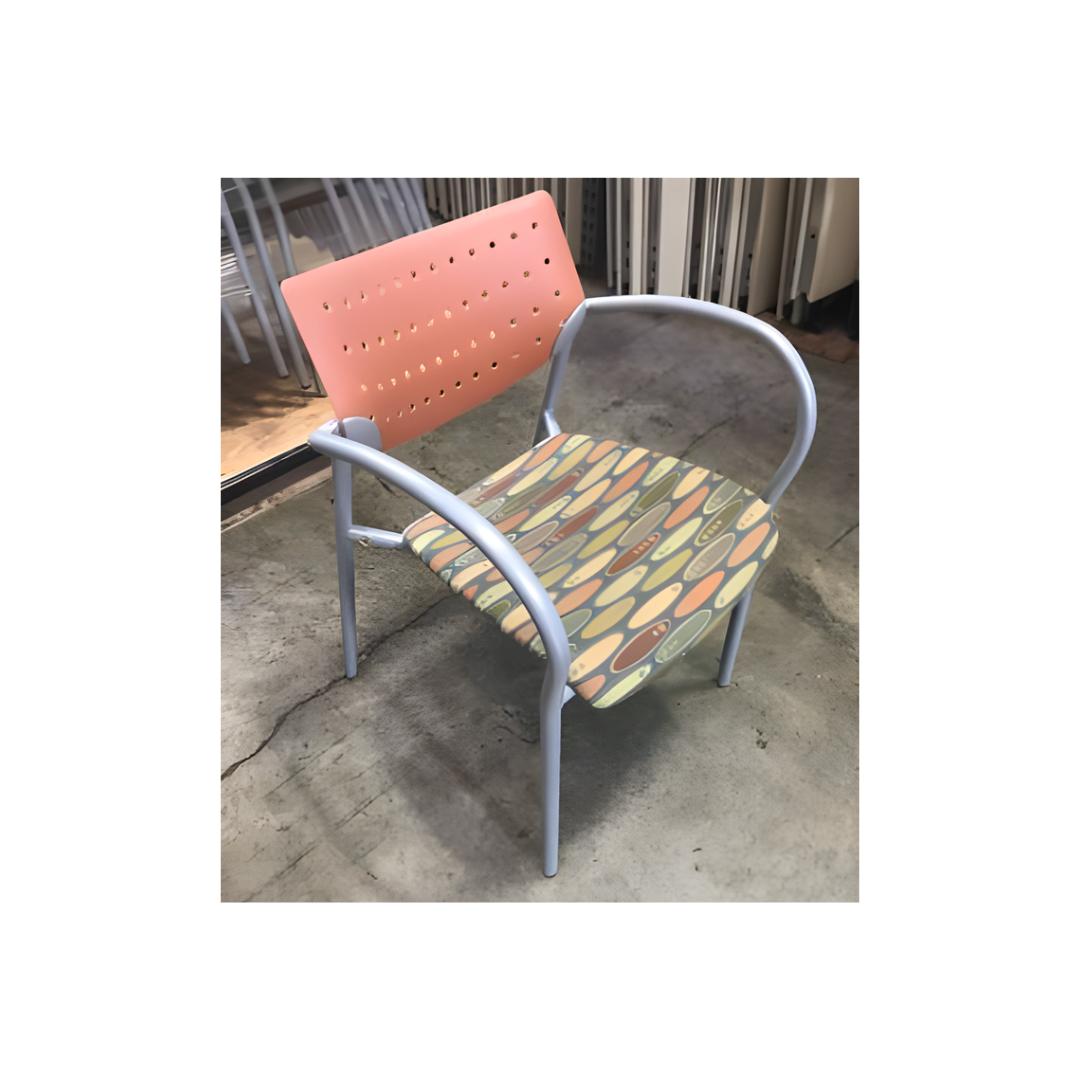 Used Keilhauer stackable chair with tubular metal frame, colorful fabric seat, and teal backrest, ideal for office or conference spaces.