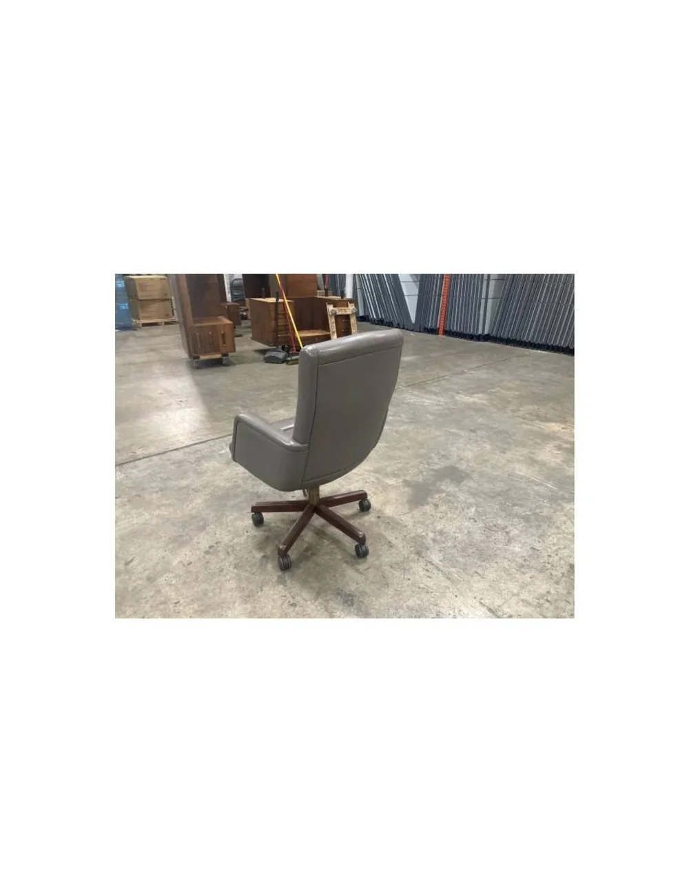 Classic gray leather office chair by Stow and Davis featuring a five-prong wood base and vintage design