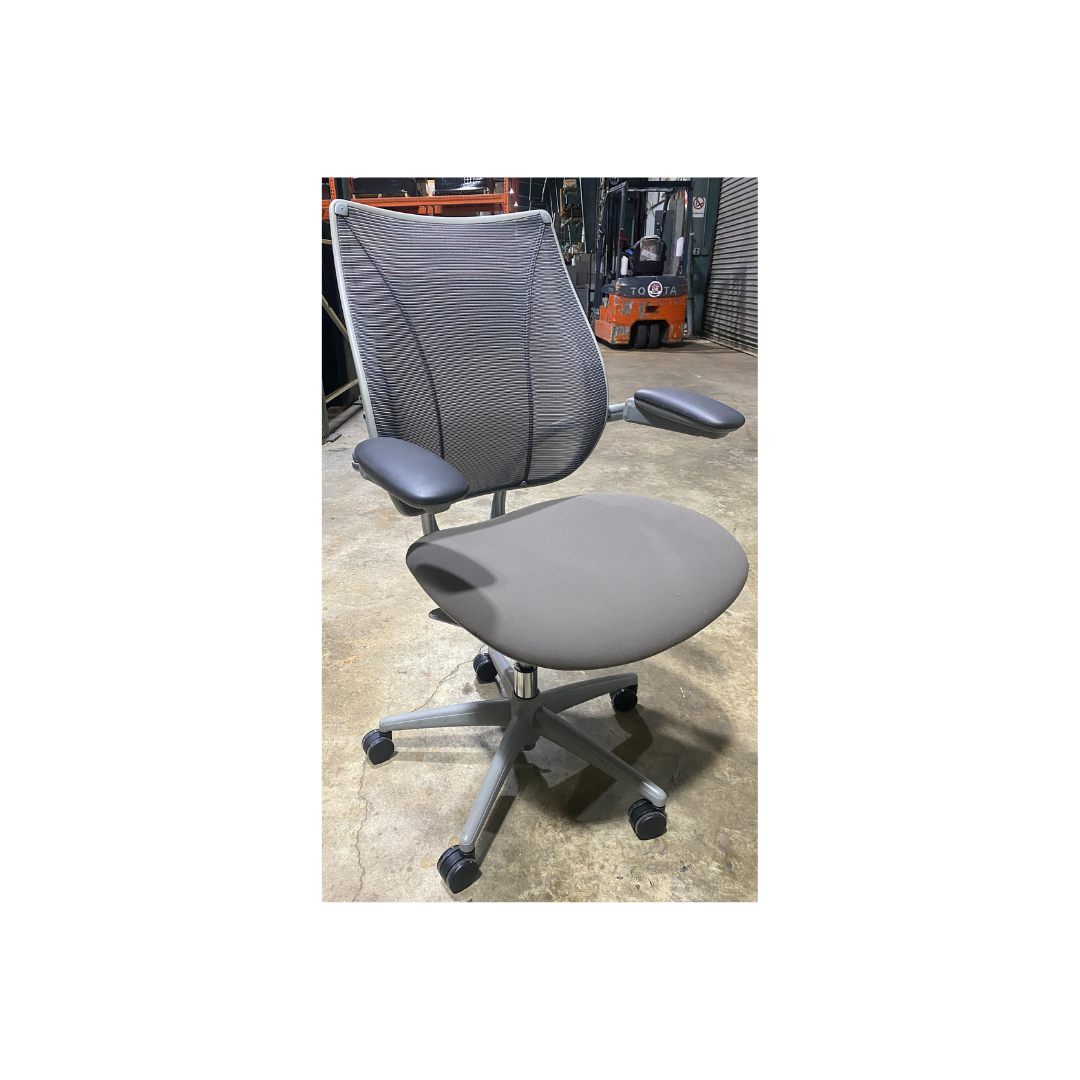 Side view of Humanscale Liberty ergonomic office chair with breathable mesh back