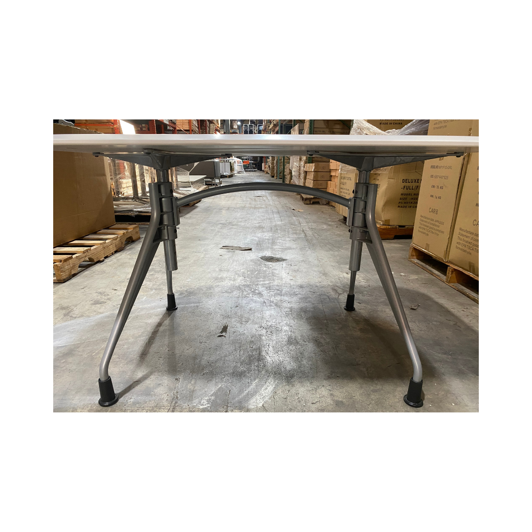 Herman Miller Avive table highlighting silver support structure and adjustable leg design