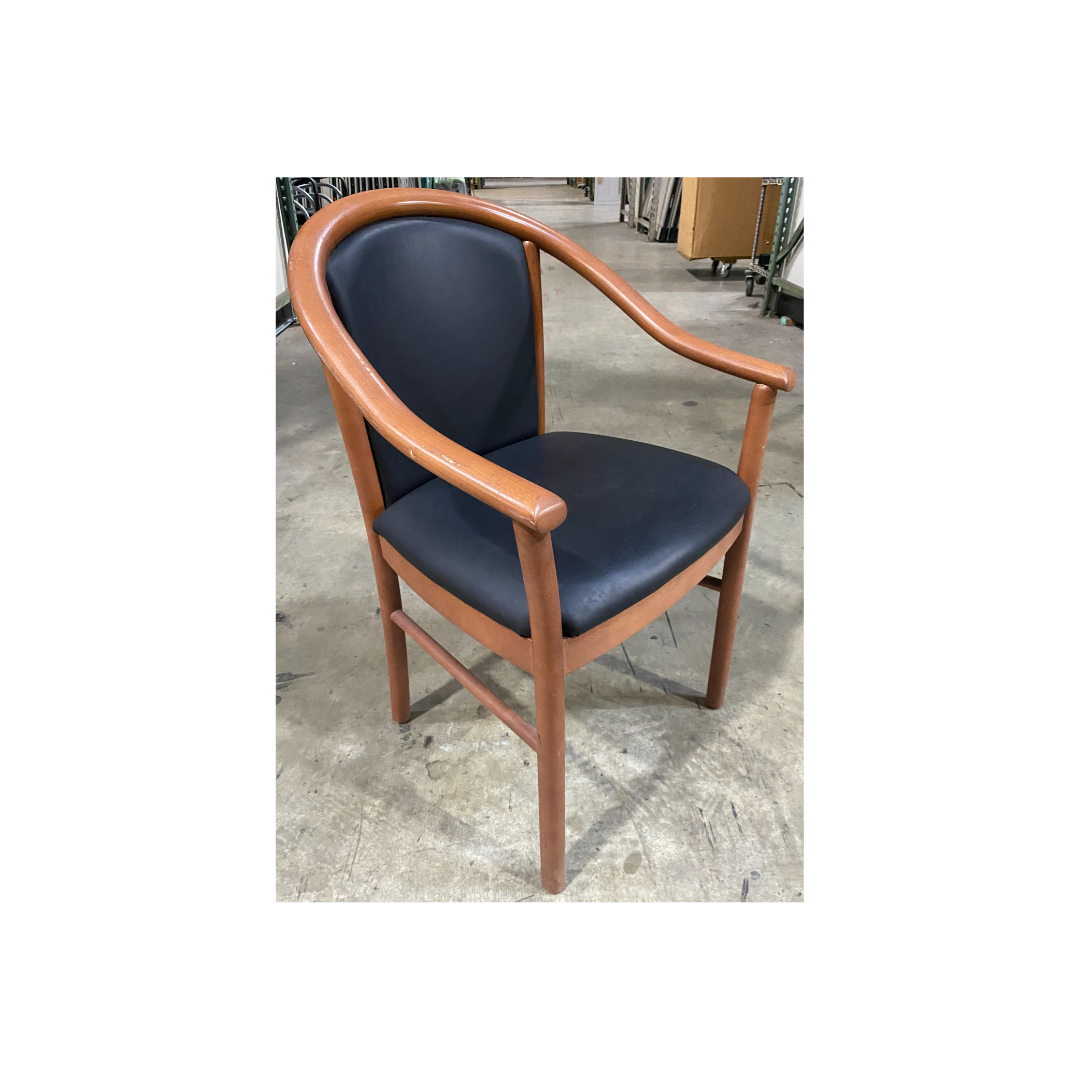Classic Steelcase wood-frame guest chair featuring continuous loop arms and vinyl upholstery